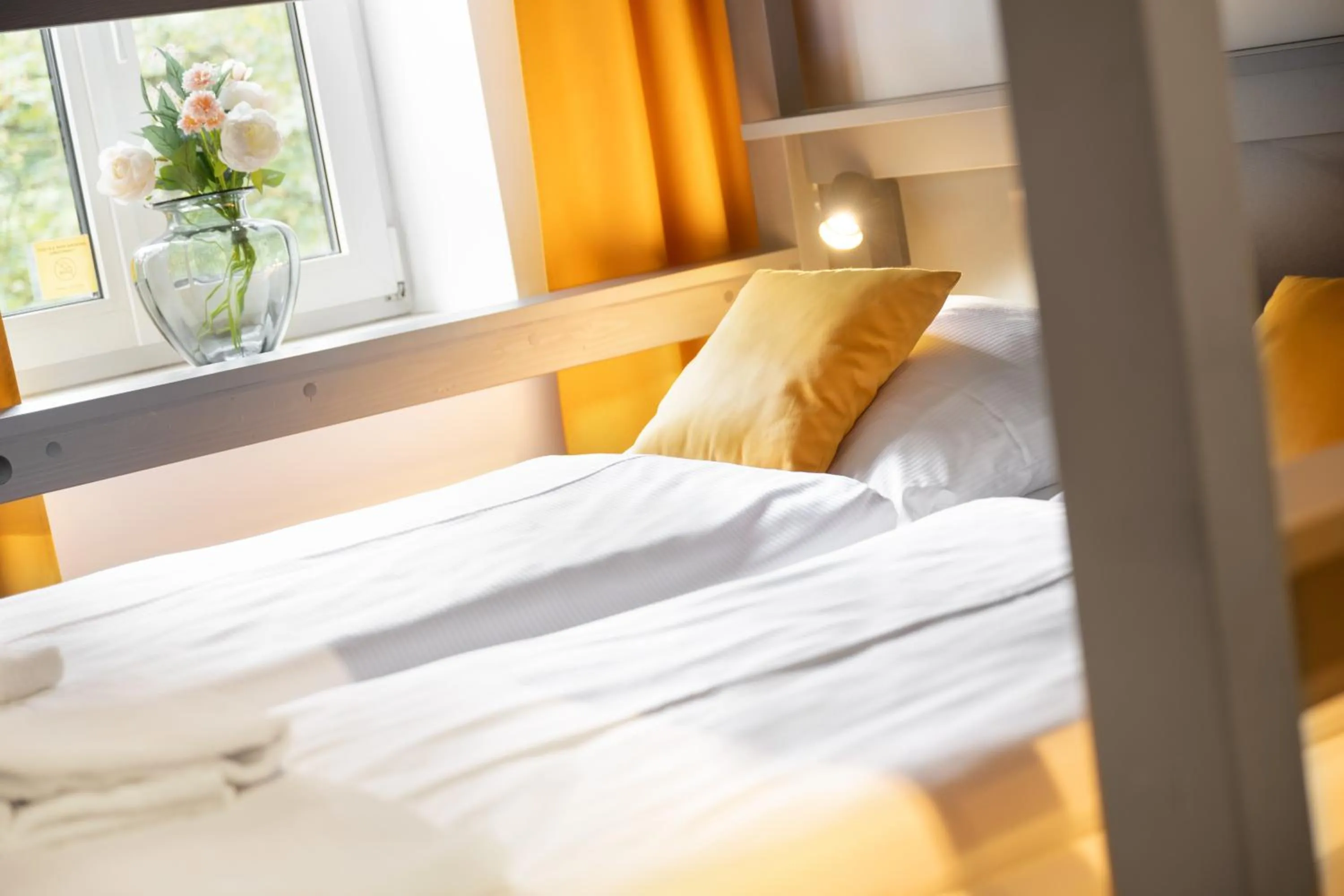 Bed in Servus Apartments by Homaris