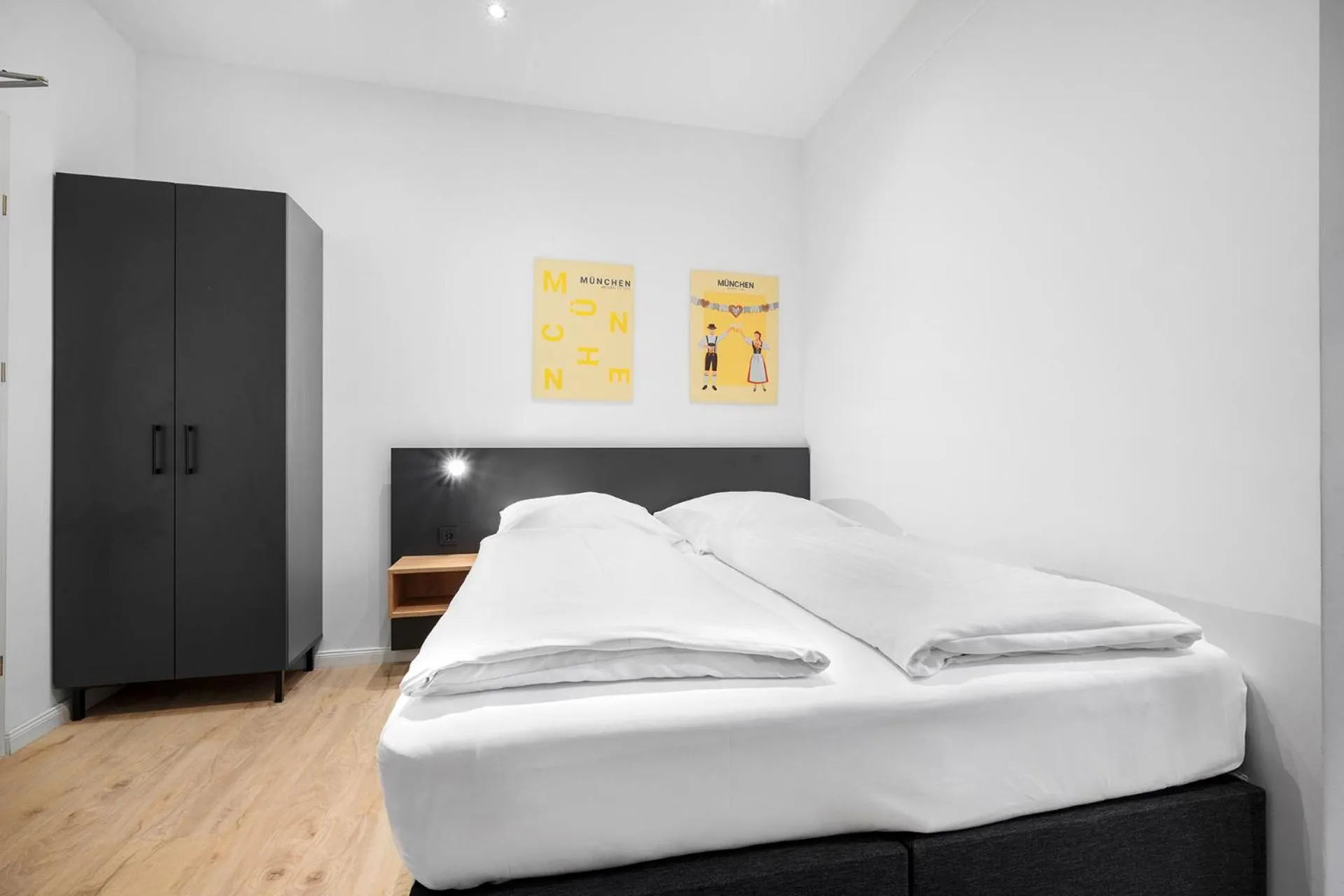 Bed in Servus Apartments by Homaris