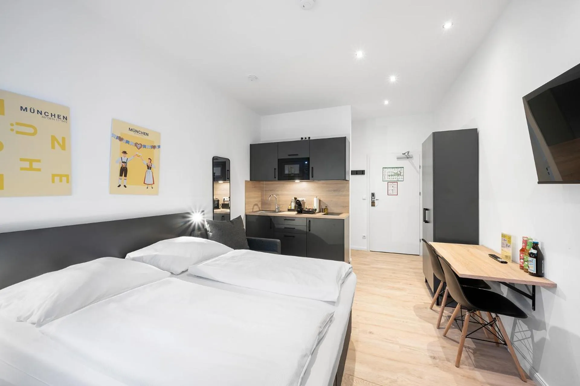 Bed in Servus Apartments by Homaris
