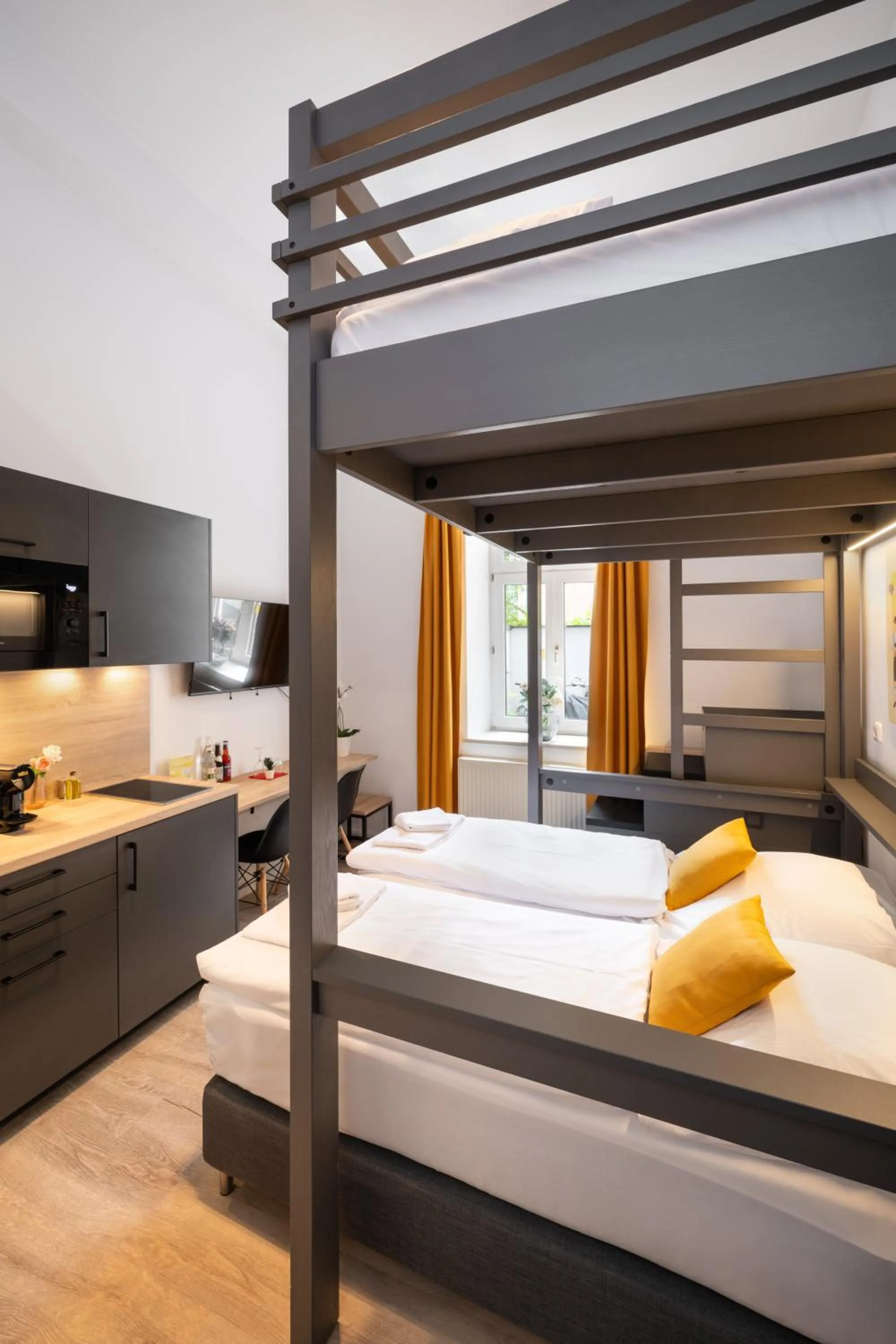 Bed in Servus Apartments by Homaris