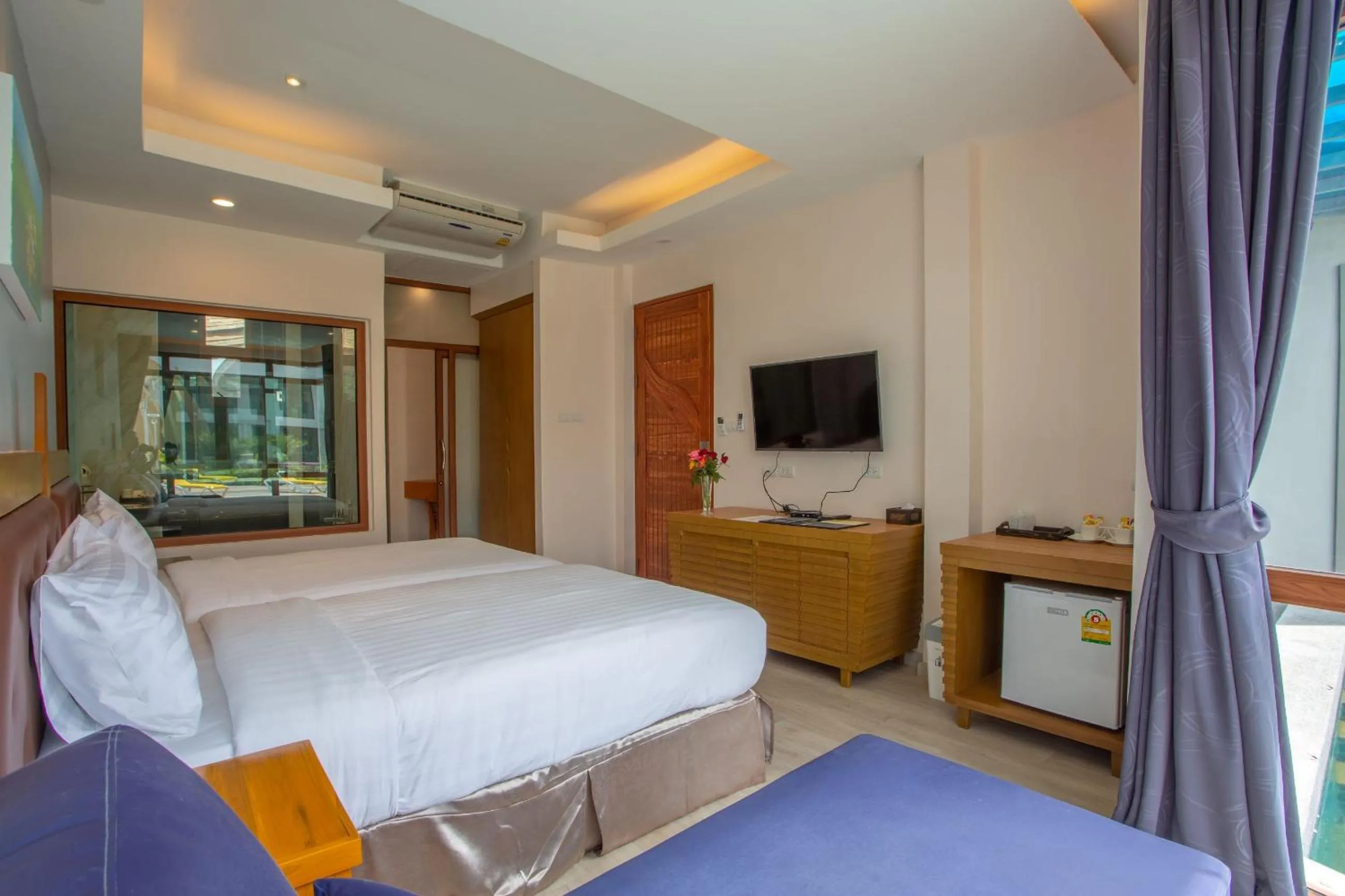 Bed in Nakaburi Sanctuary Resort&Spa