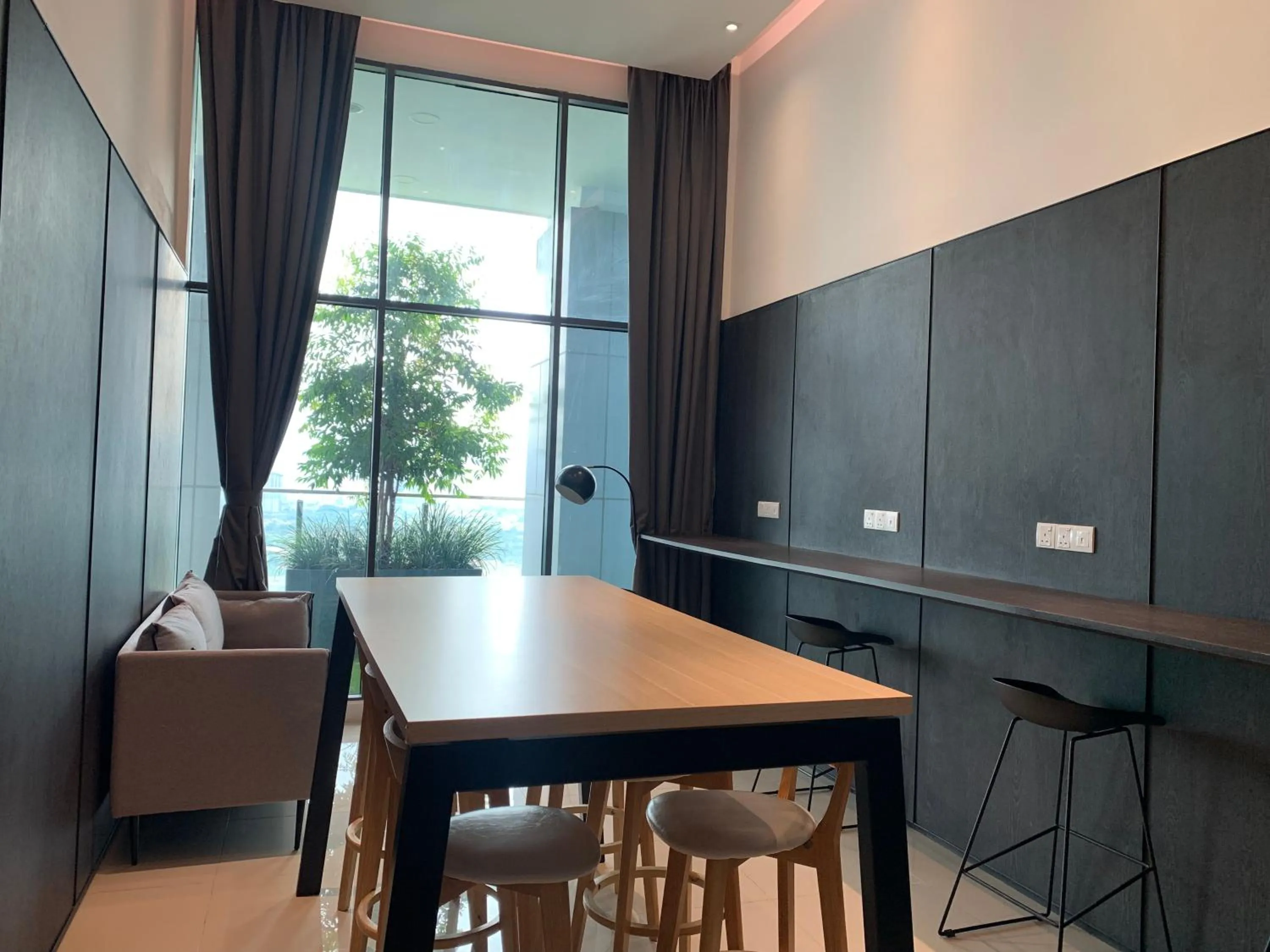 Communal lounge/ TV room in LUXE Infinitum KLCC by WSD