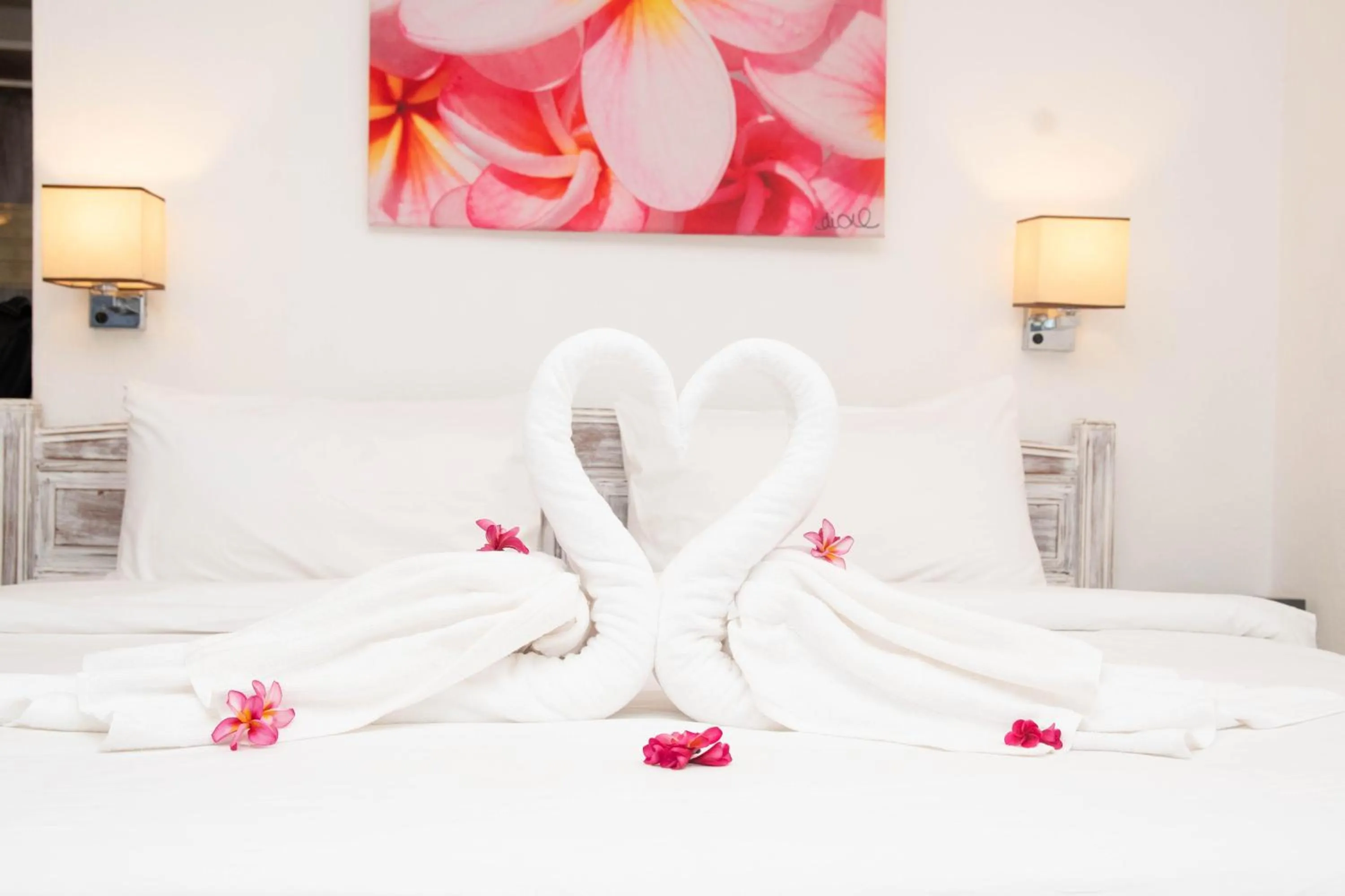 Bed in Hibiscus Boutique Hotel