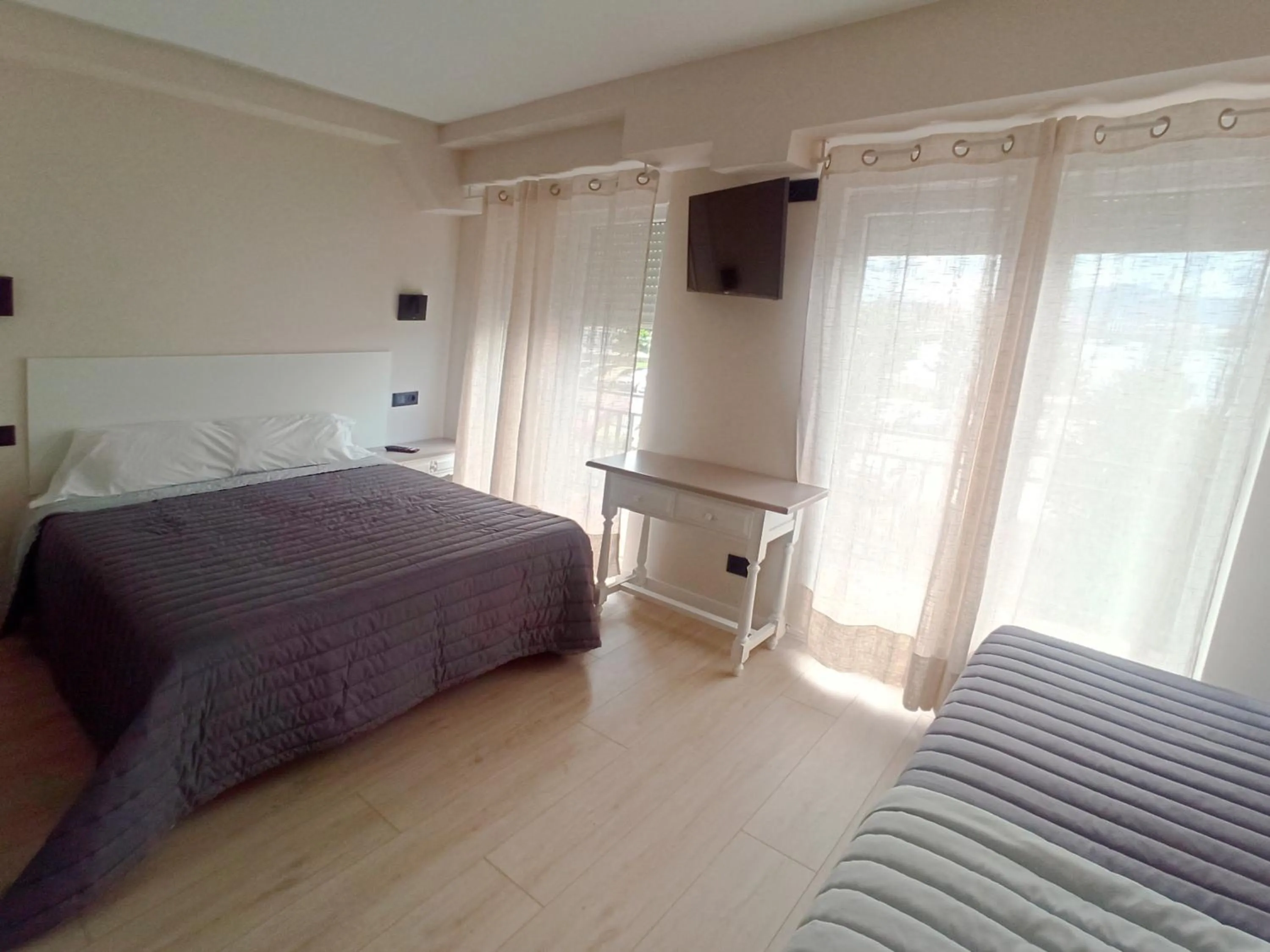 Bed in Bahia Rooms Cantabria 3000