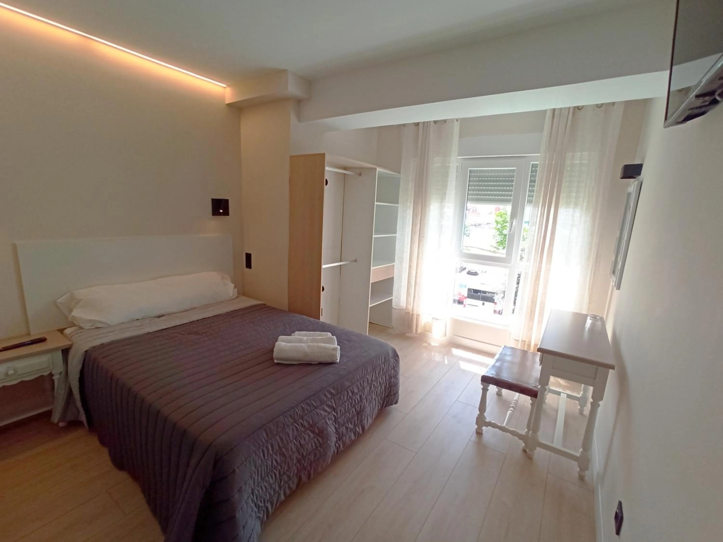Bed in Bahia Rooms Cantabria 3000