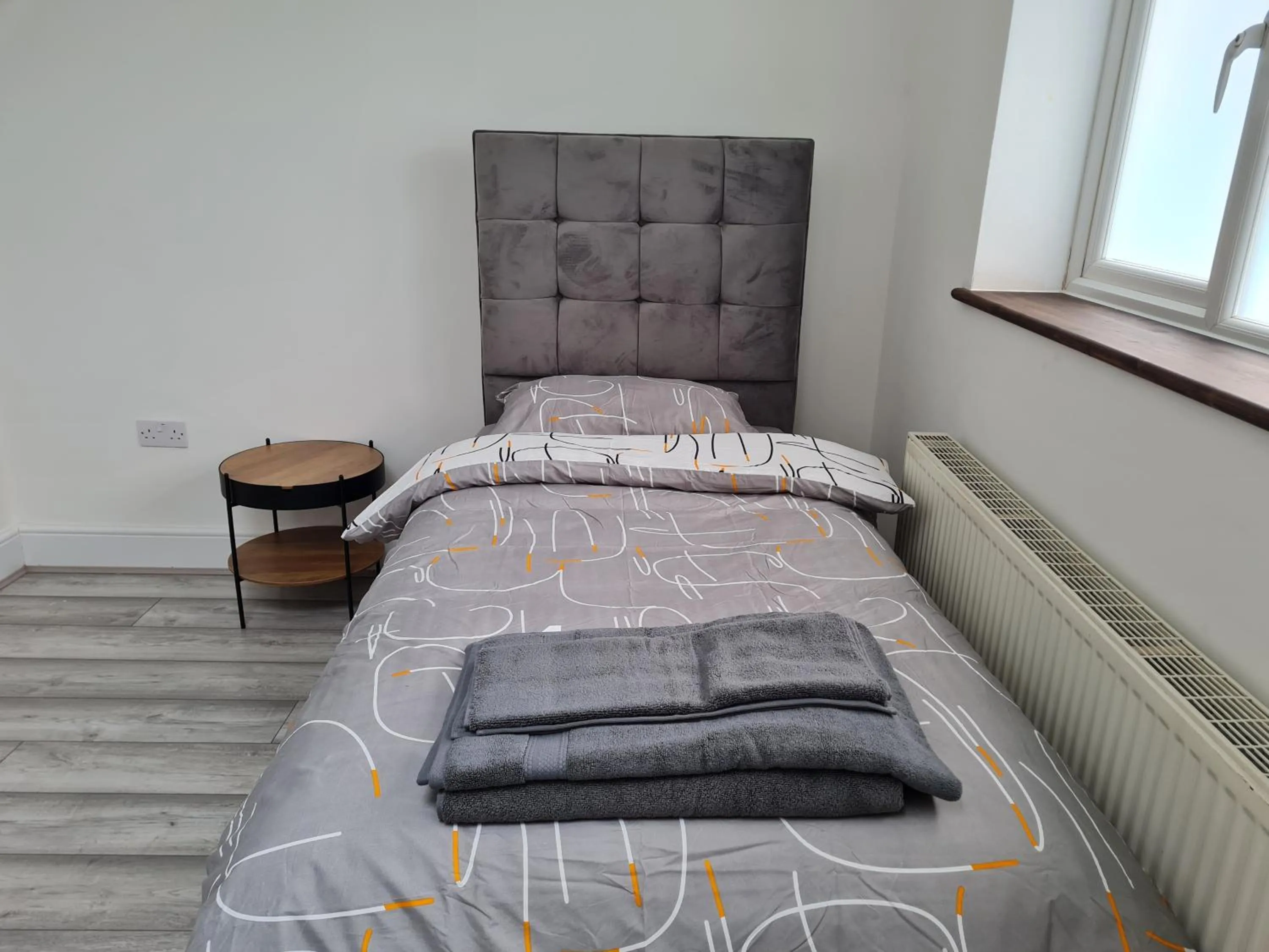 Bed in Stylish Suites with kitchenette