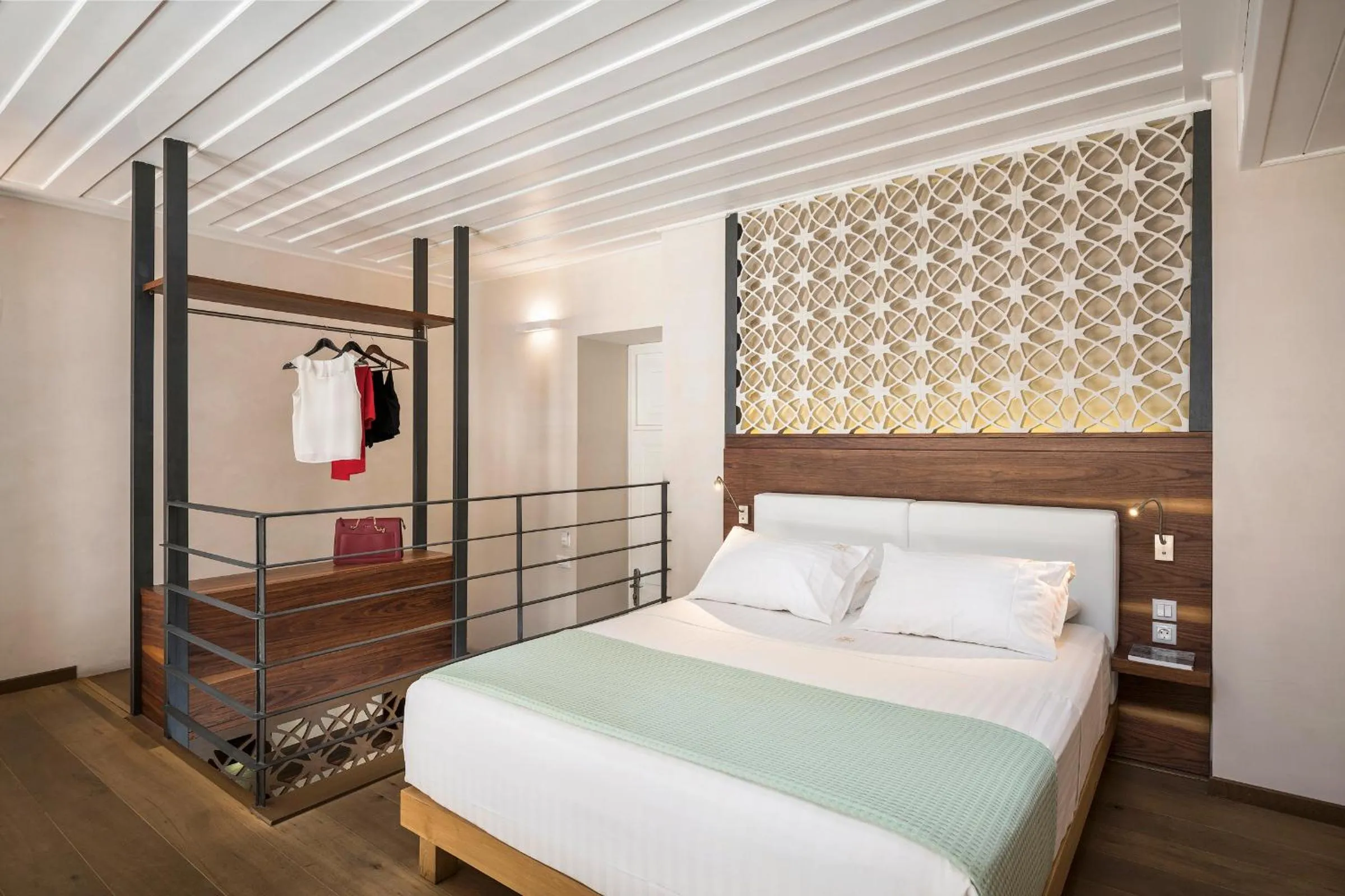 Bed in Ambassadors Residence Boutique Hotel