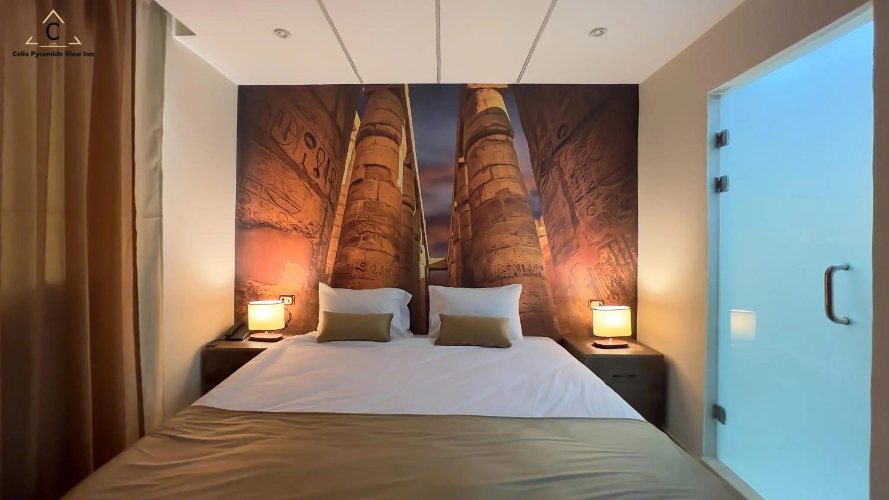 Bed in Celia Pyramids View inn