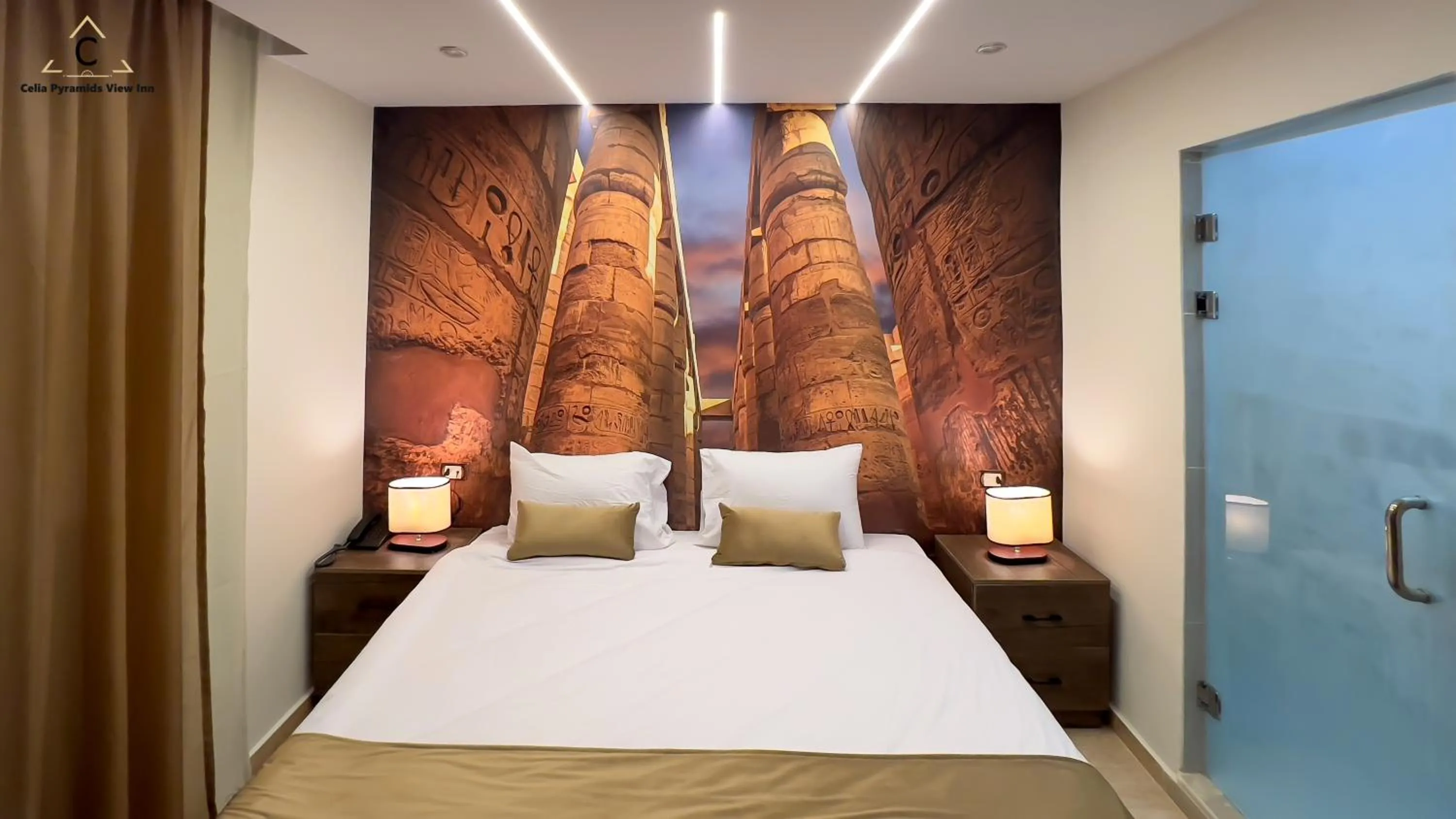 Bed in Celia Pyramids View inn