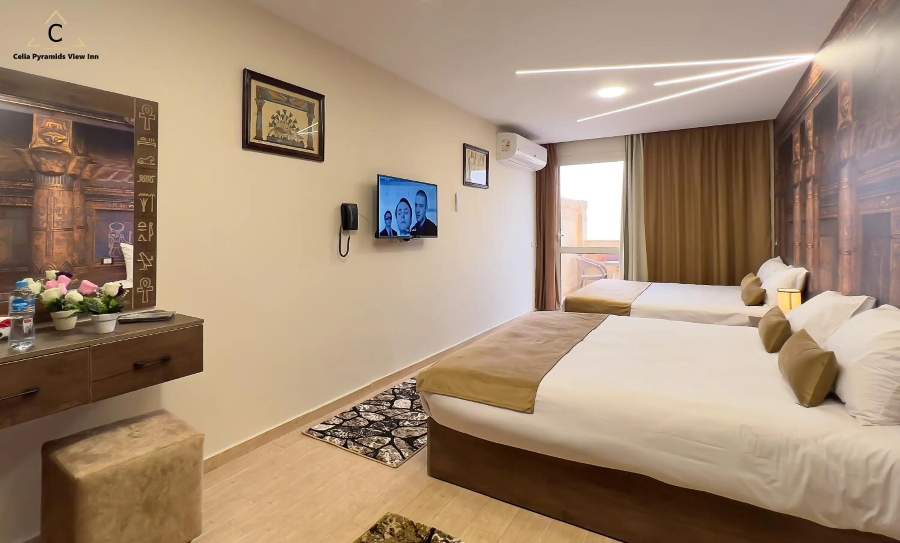 Communal lounge/ TV room, Bed in Celia Pyramids View inn