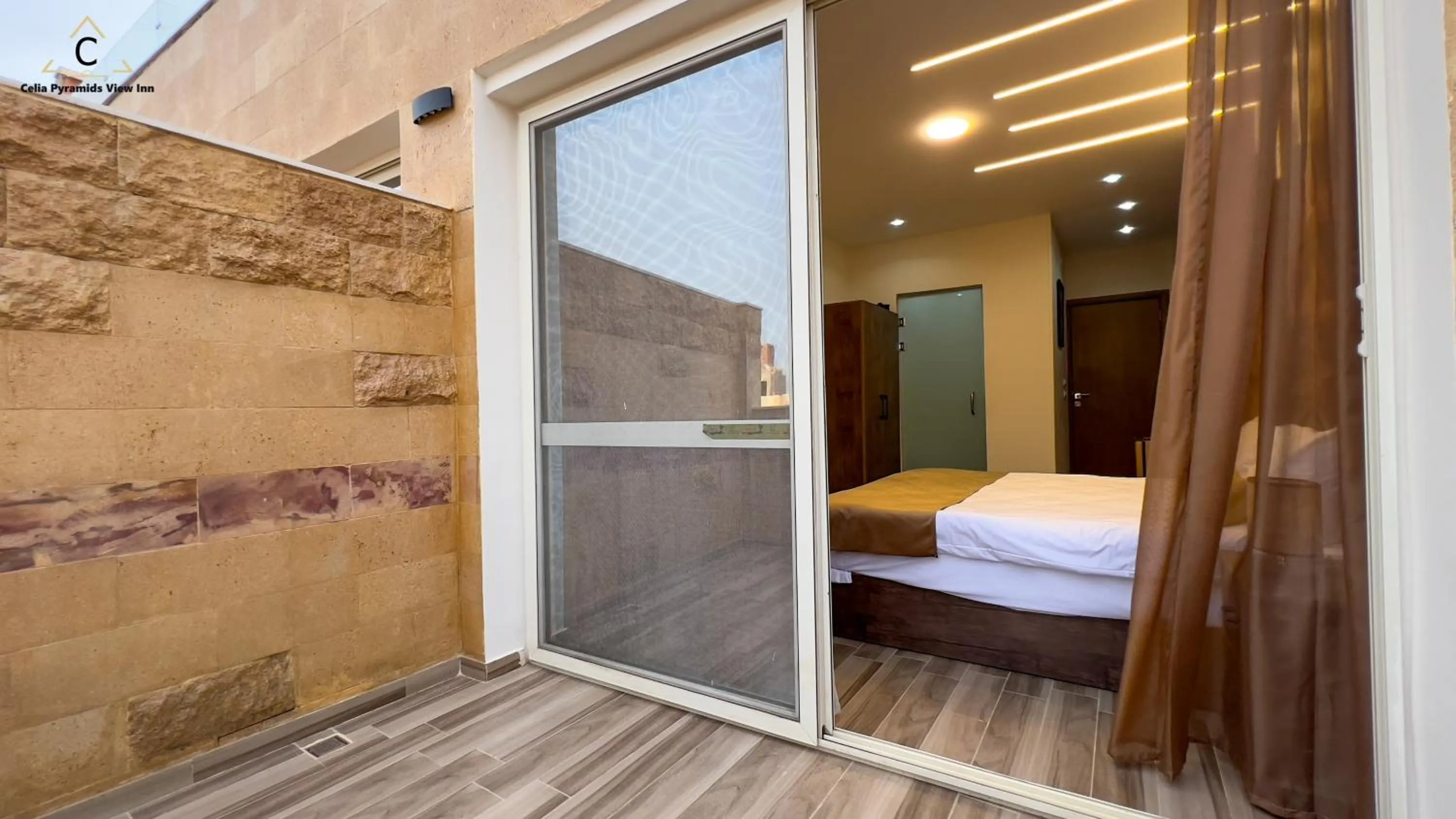 Bed in Celia Pyramids View inn