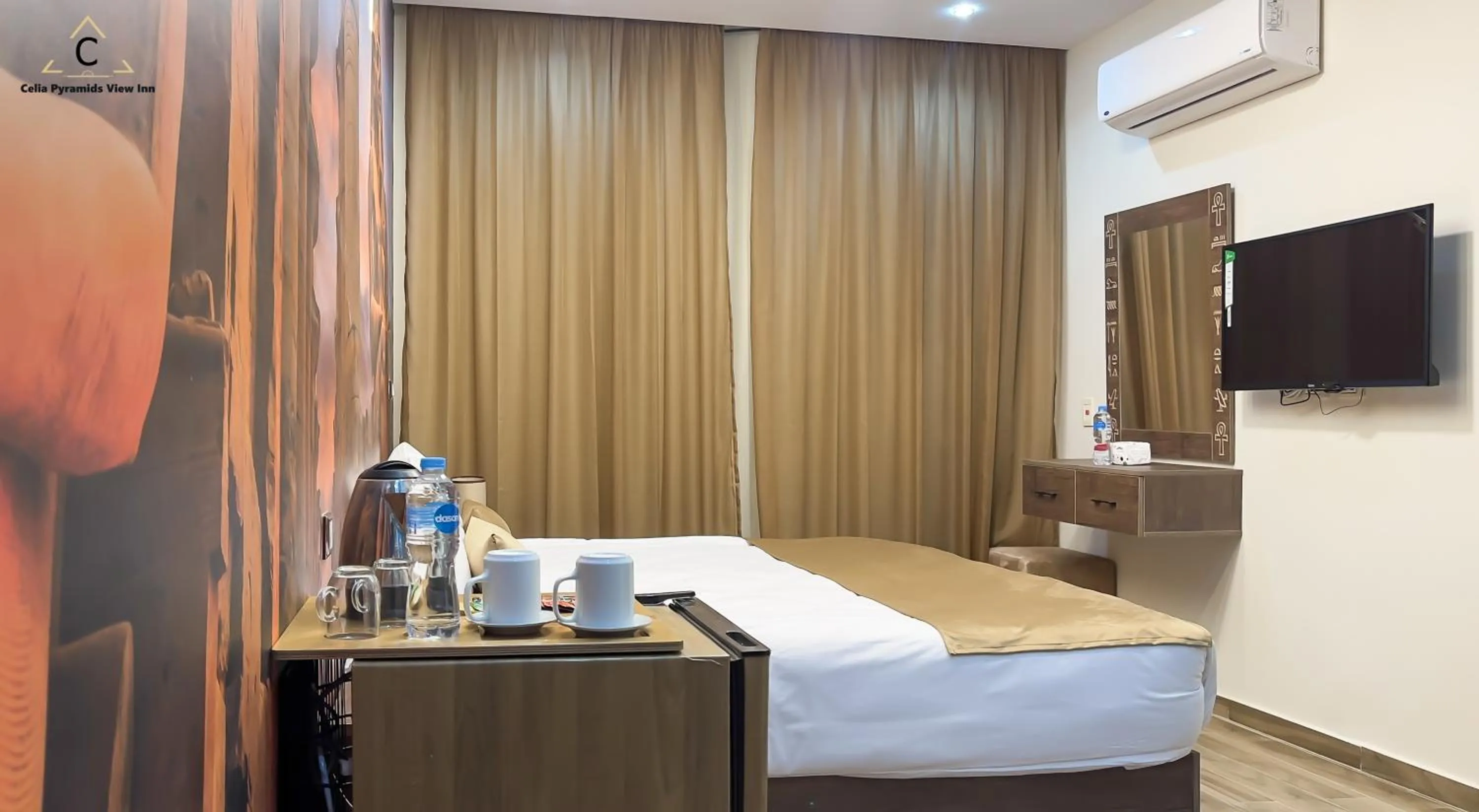 Bed in Celia Pyramids View inn