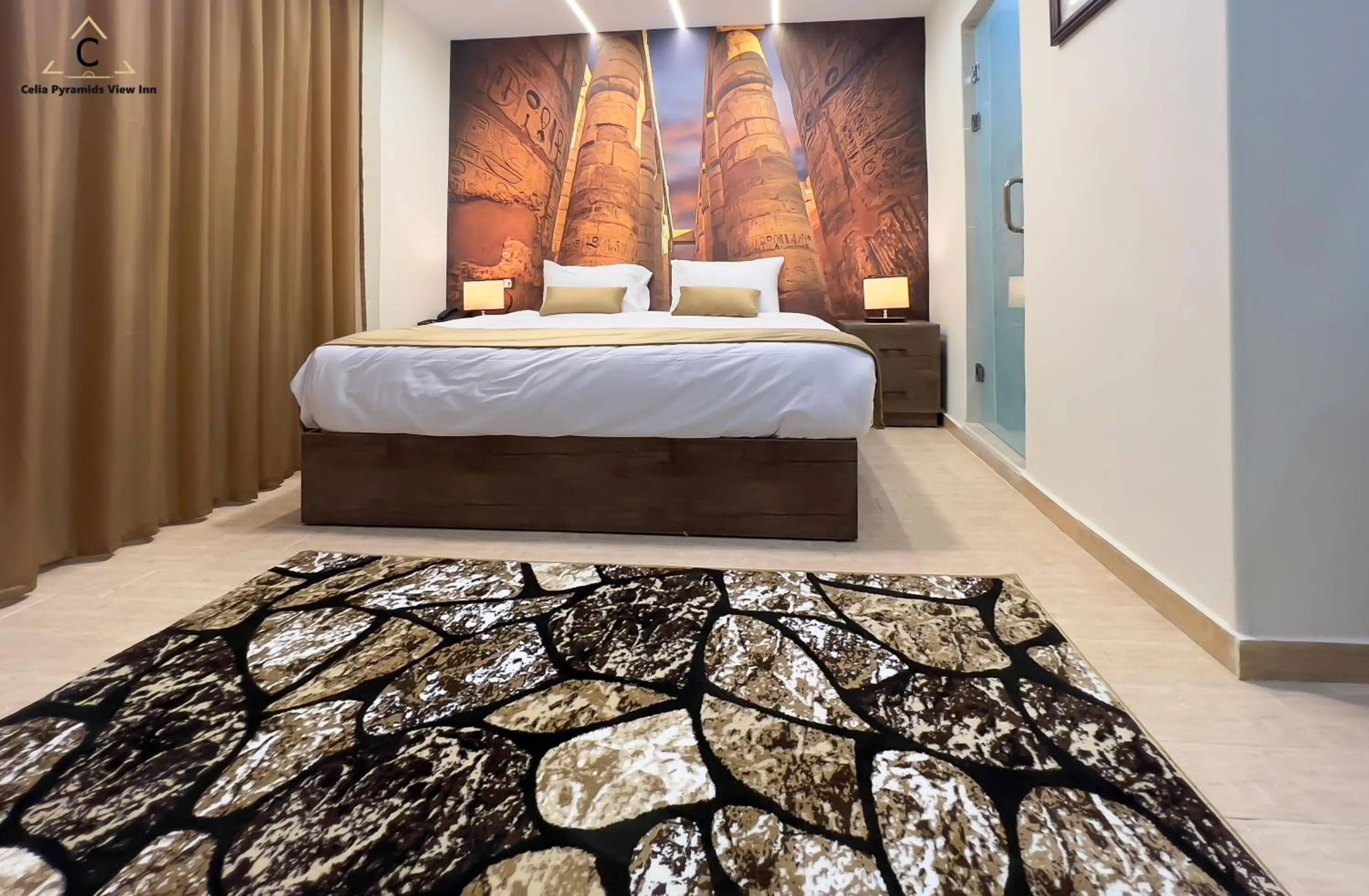 Bed in Celia Pyramids View inn