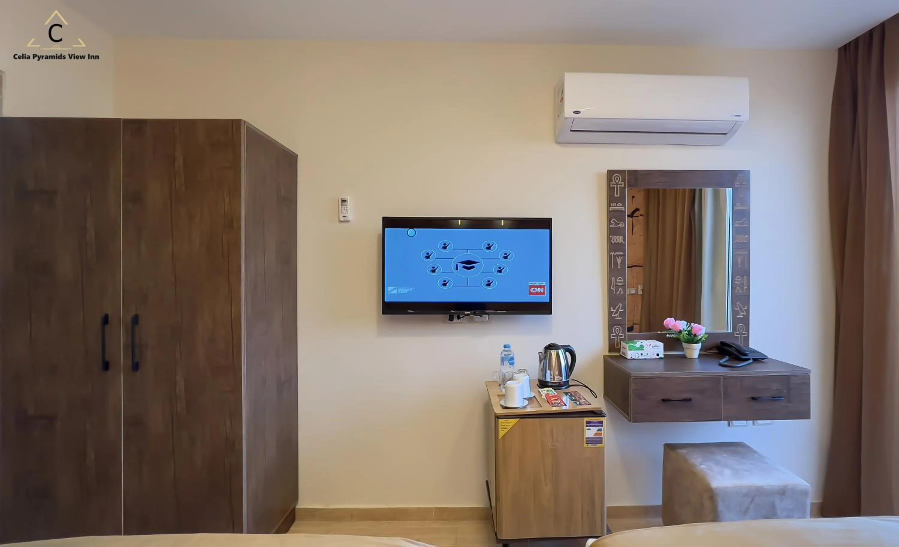 Bed in Celia Pyramids View inn