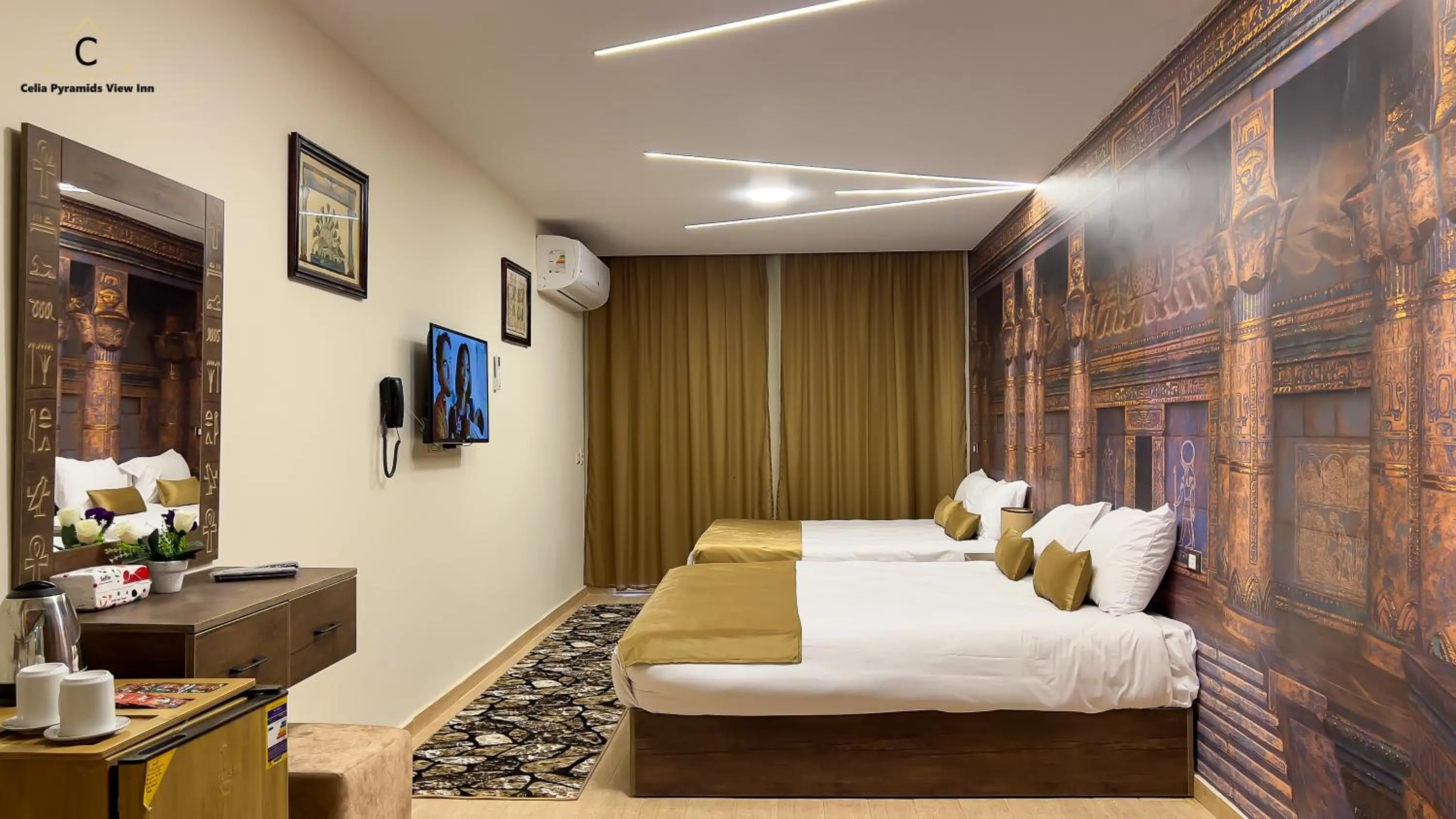 Bed in Celia Pyramids View inn