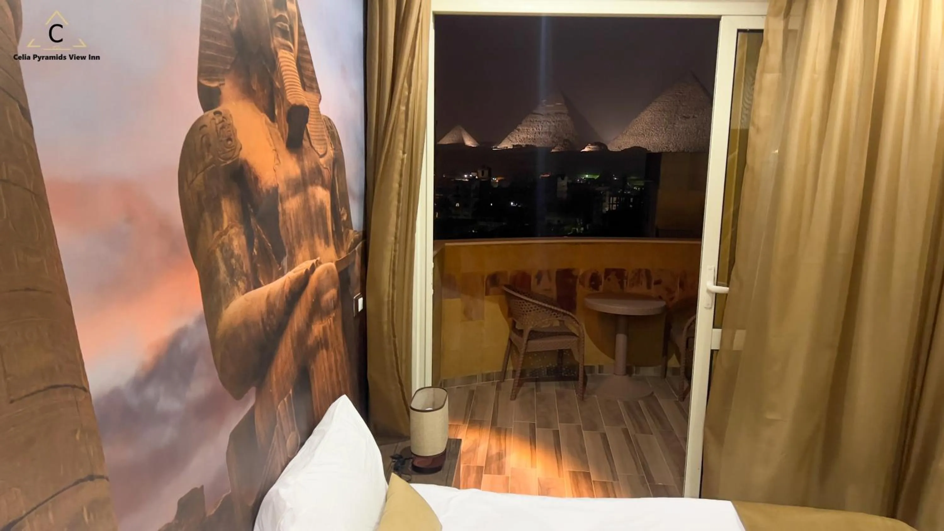 Bed in Celia Pyramids View inn