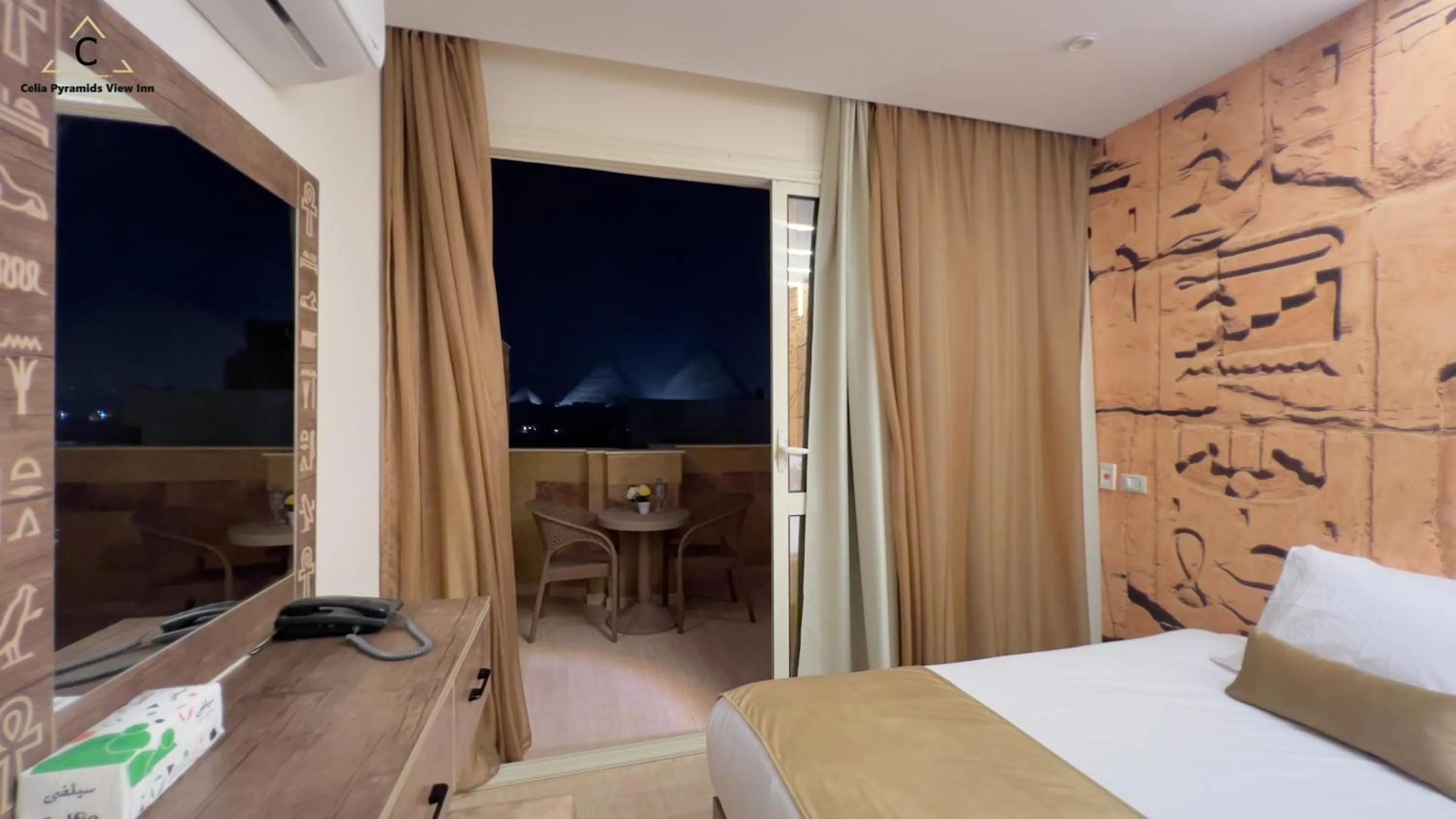 Bed in Celia Pyramids View inn