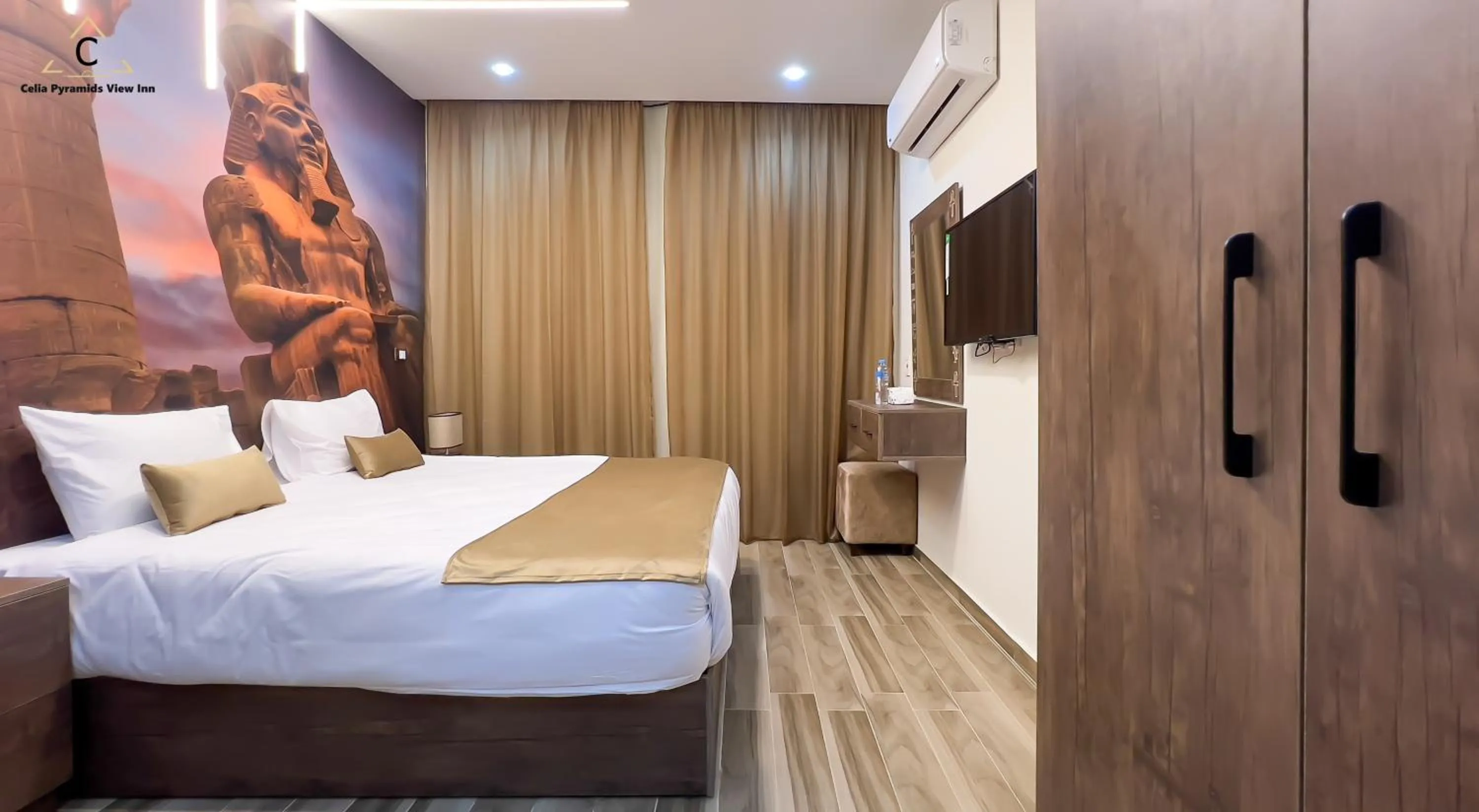 Bed in Celia Pyramids View inn