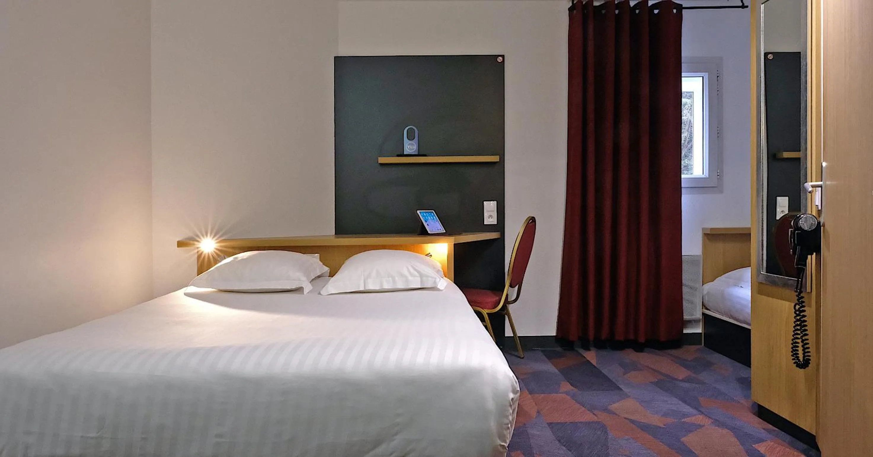 Photo of the whole room, Bed in In Hotel Nancy Frouard