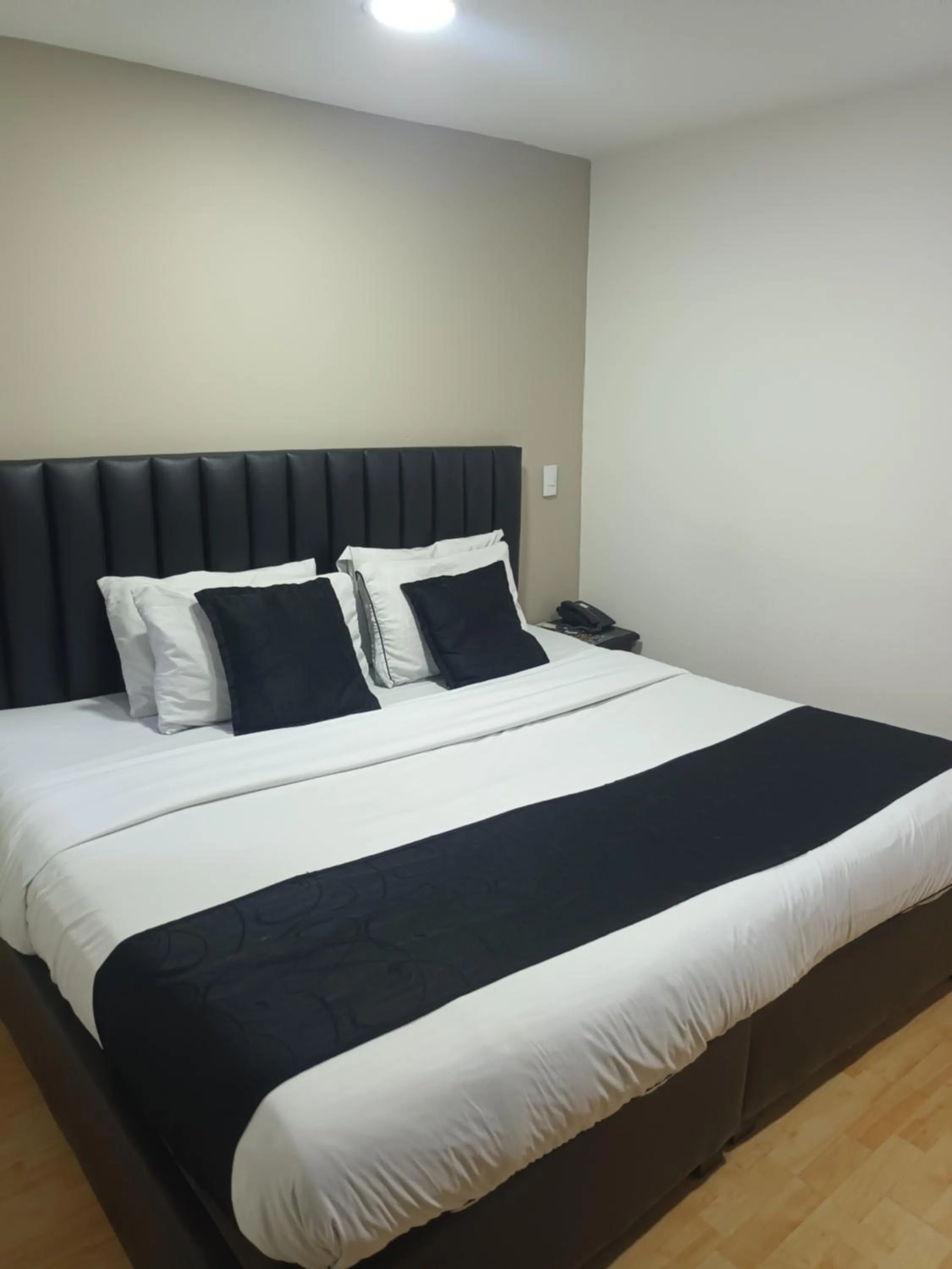 Bed in Hotel Santiago Plaza