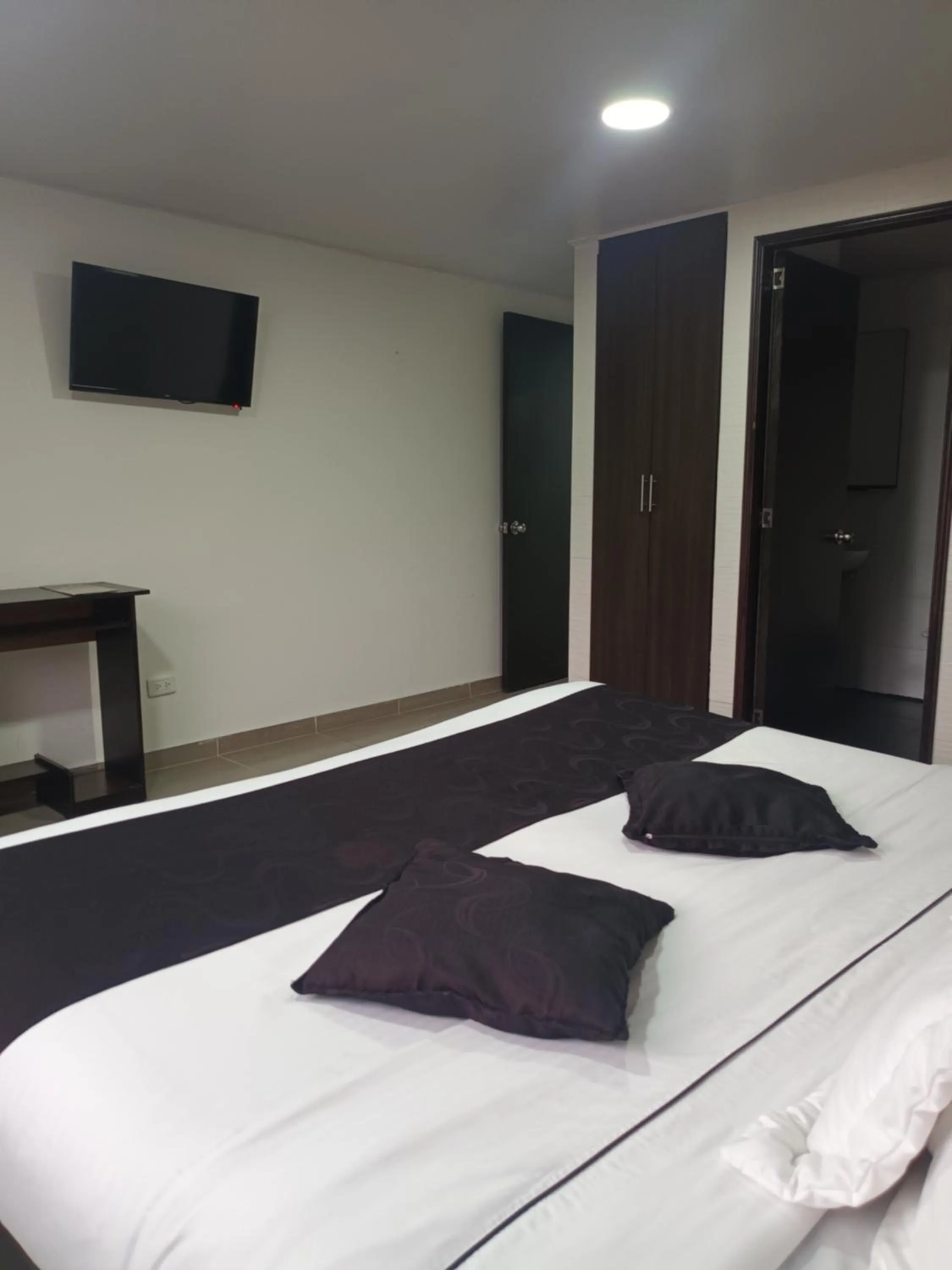 Bed in Hotel Santiago Plaza