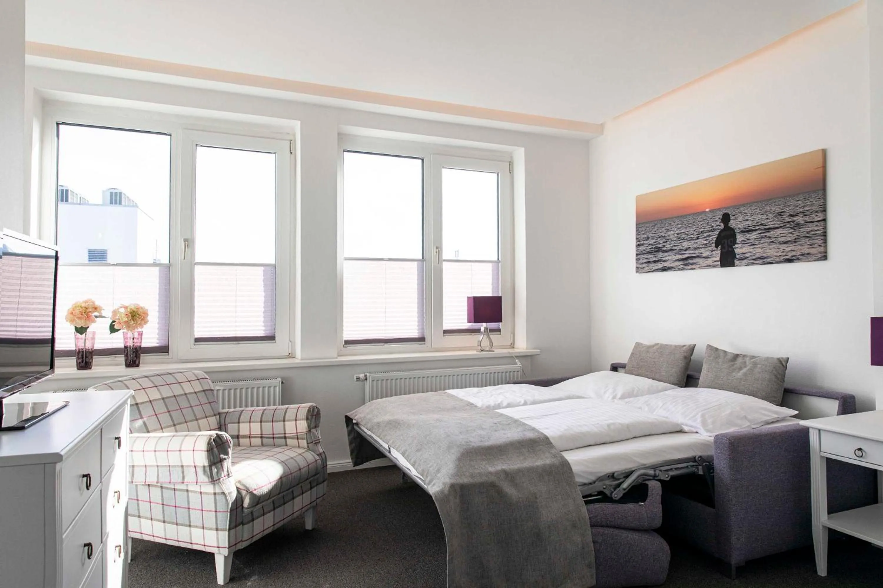 Bed in Luxx City Apartments