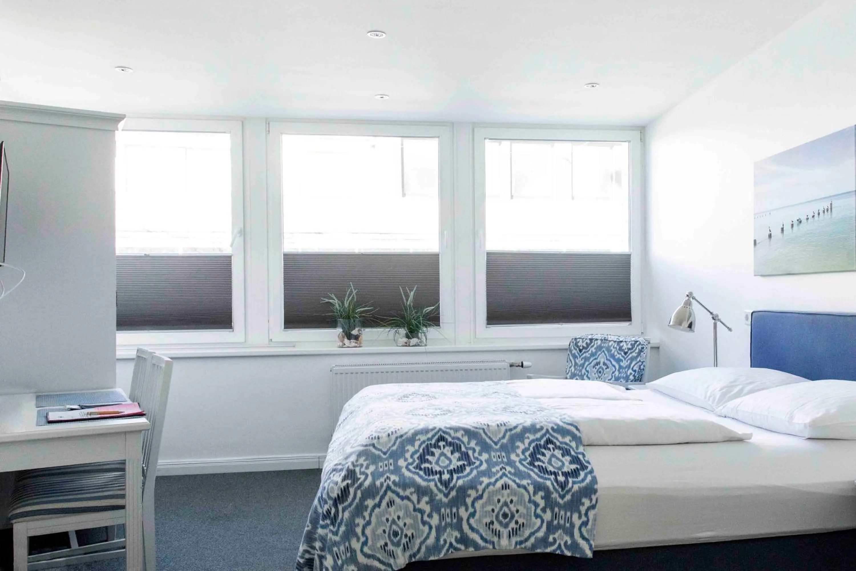 Bed in Luxx City Apartments