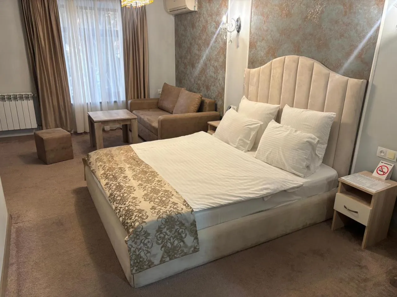 Bed in DeLin Hotel And Tours