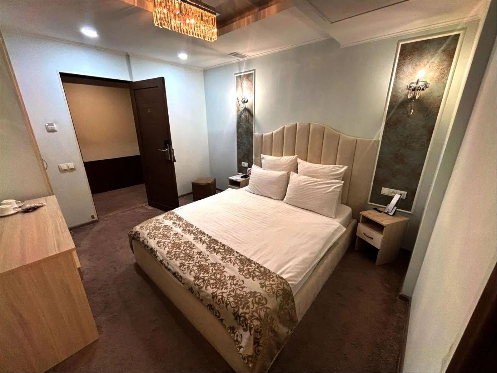 Bed in DeLin Hotel And Tours