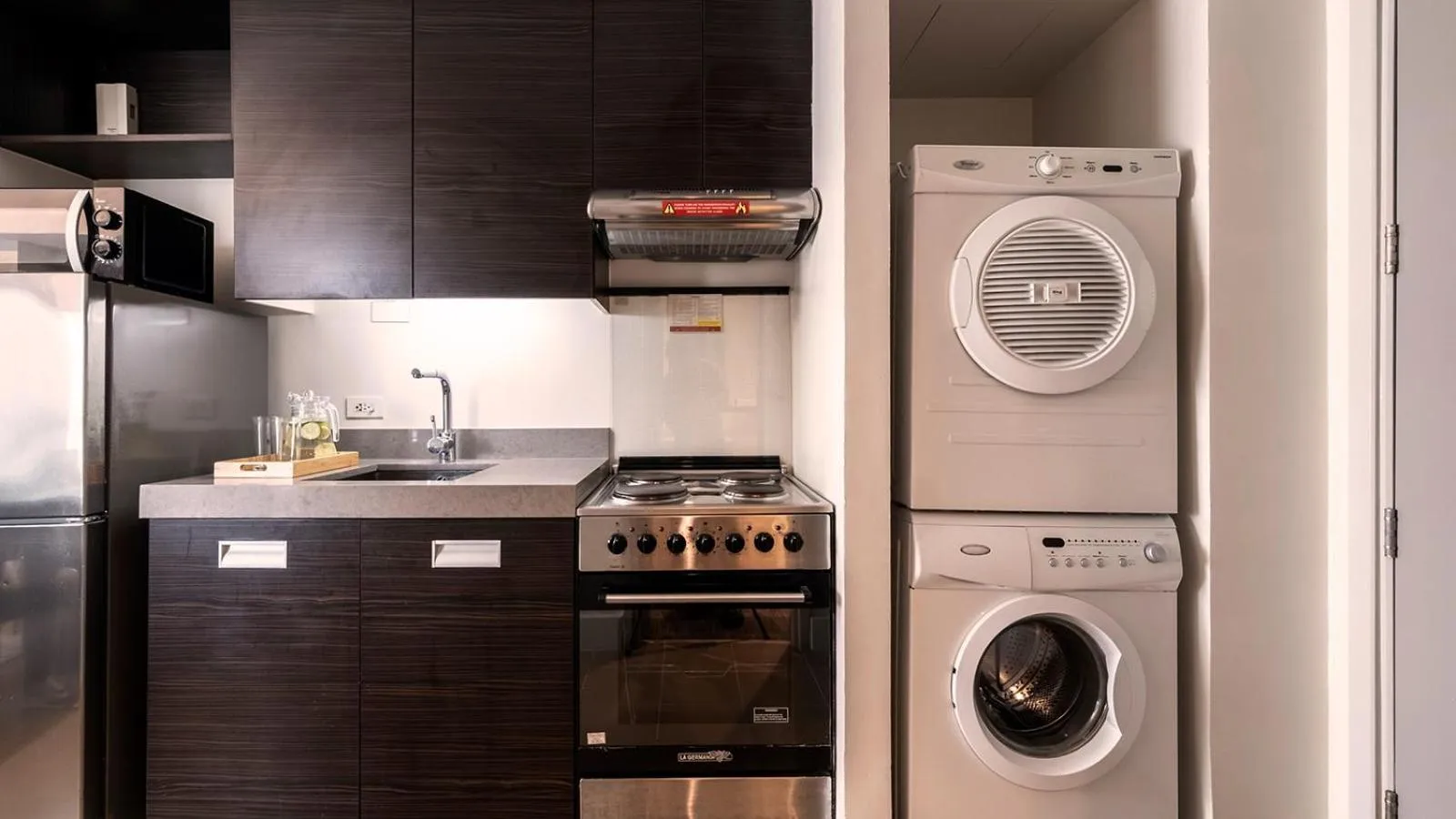 washing machine in Aruga Apartments by Rockwell Makati
