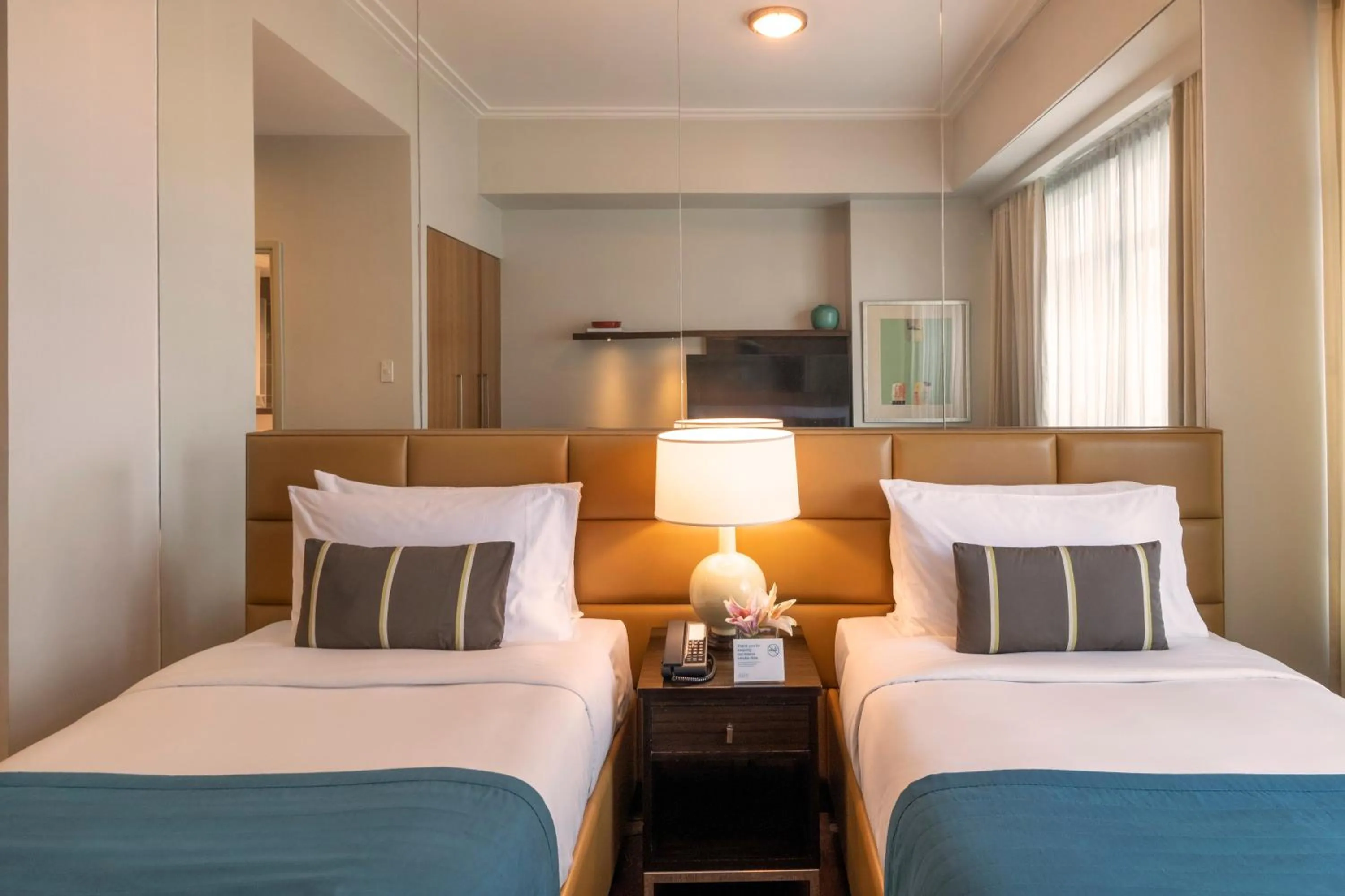 Bed in Aruga Apartments by Rockwell Makati