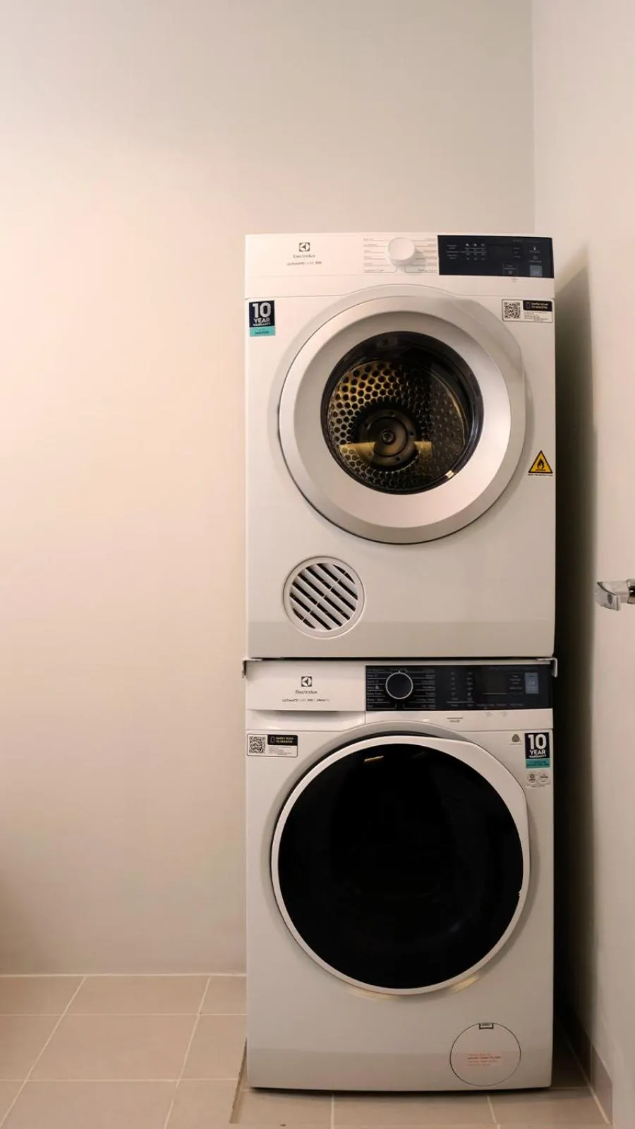 washing machine in Aruga Apartments by Rockwell Makati