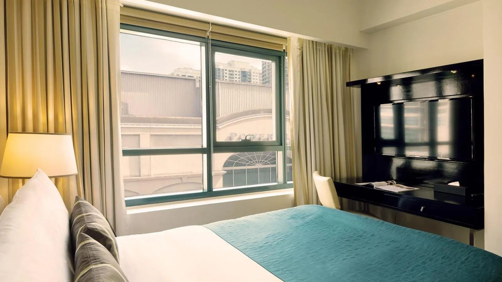 Bed in Aruga Apartments by Rockwell Makati