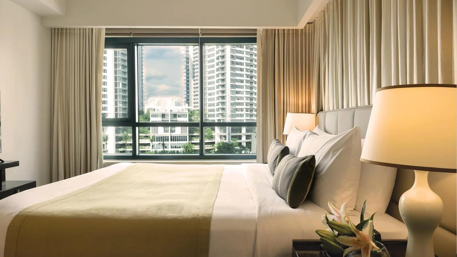 Bed in Aruga Apartments by Rockwell Makati