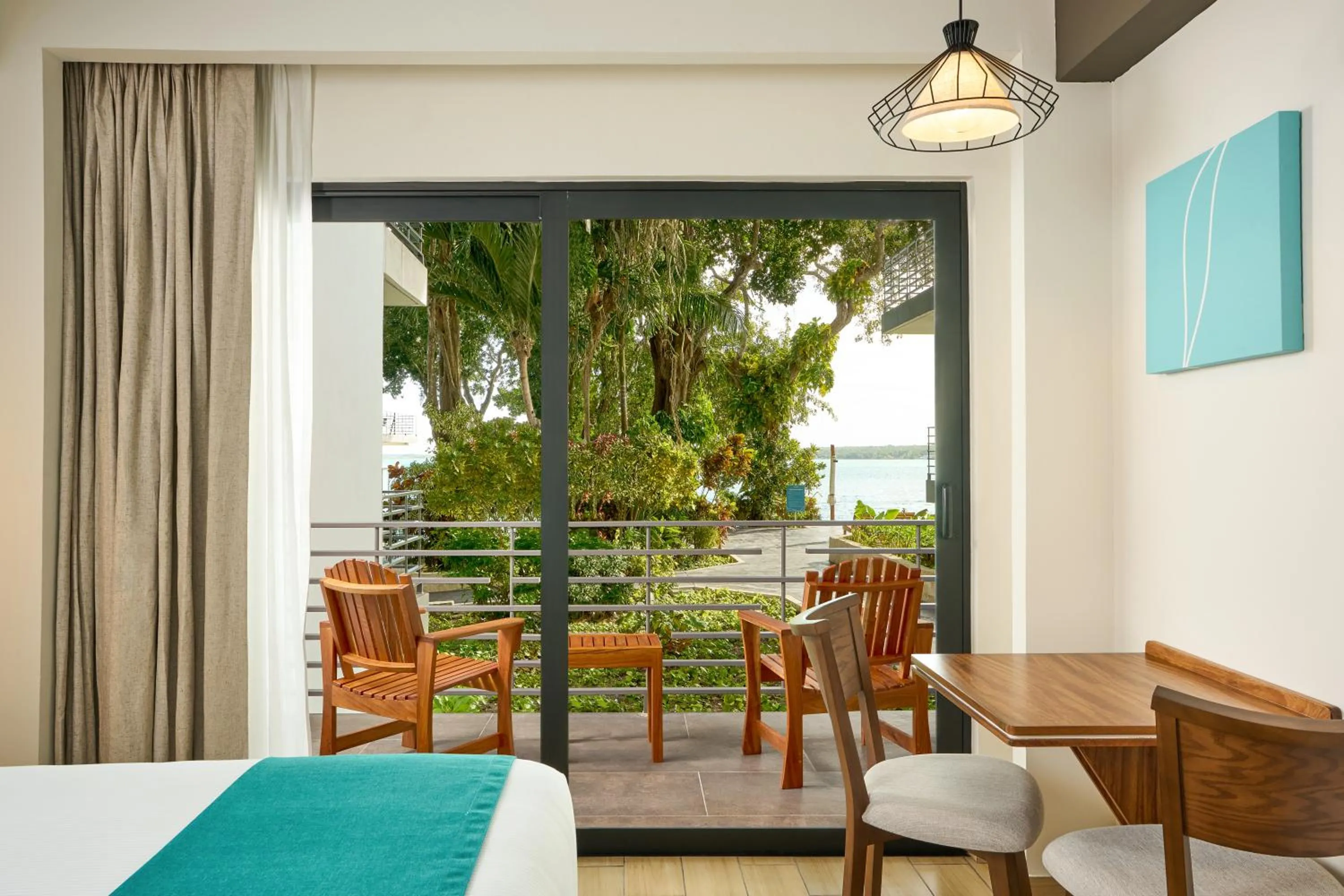 Balcony/Terrace, Bed in Cristalino Lagoon Front Hotel, Restaurant & Spa