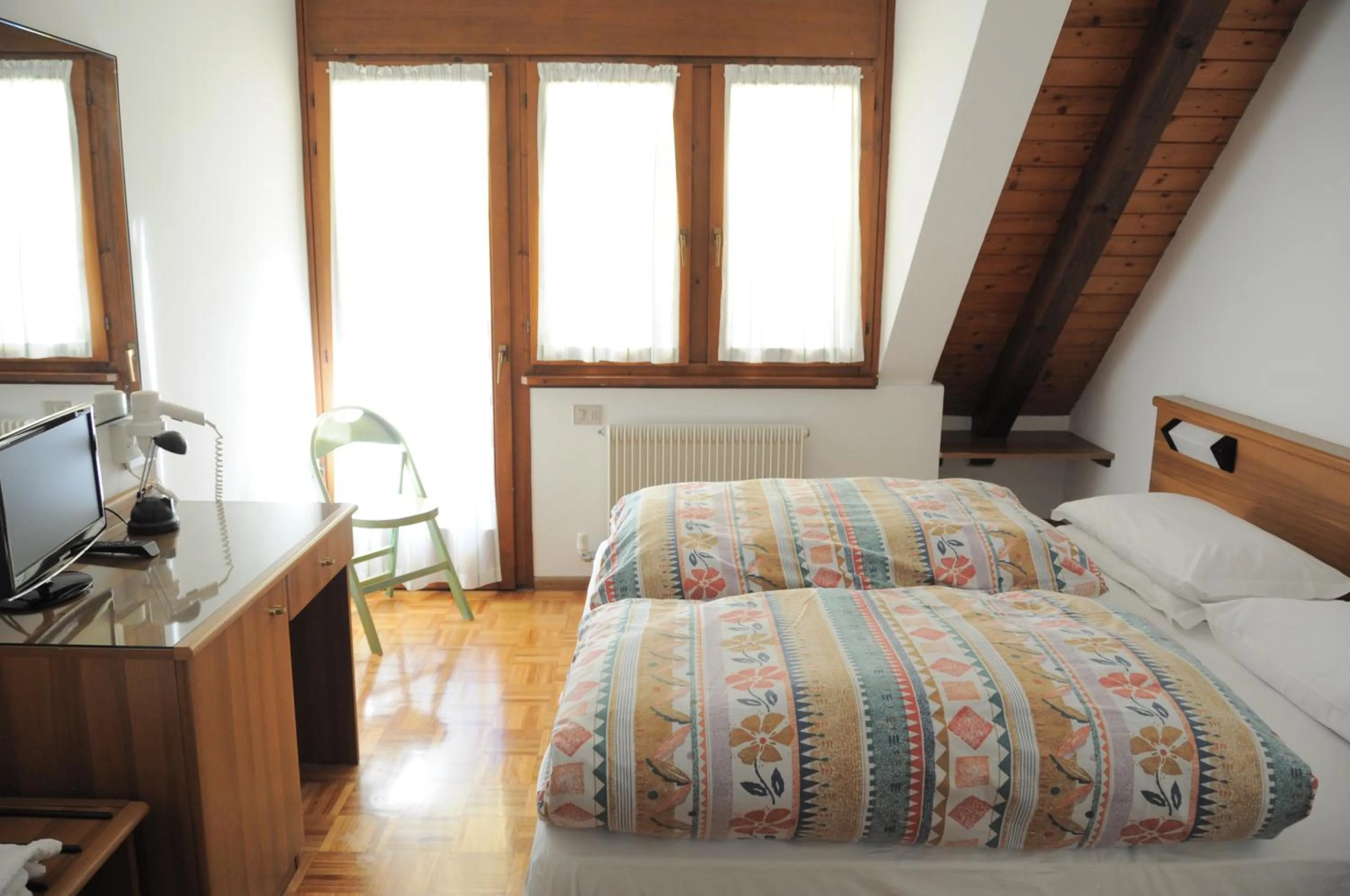 Bed in Hotel Europa Cembra