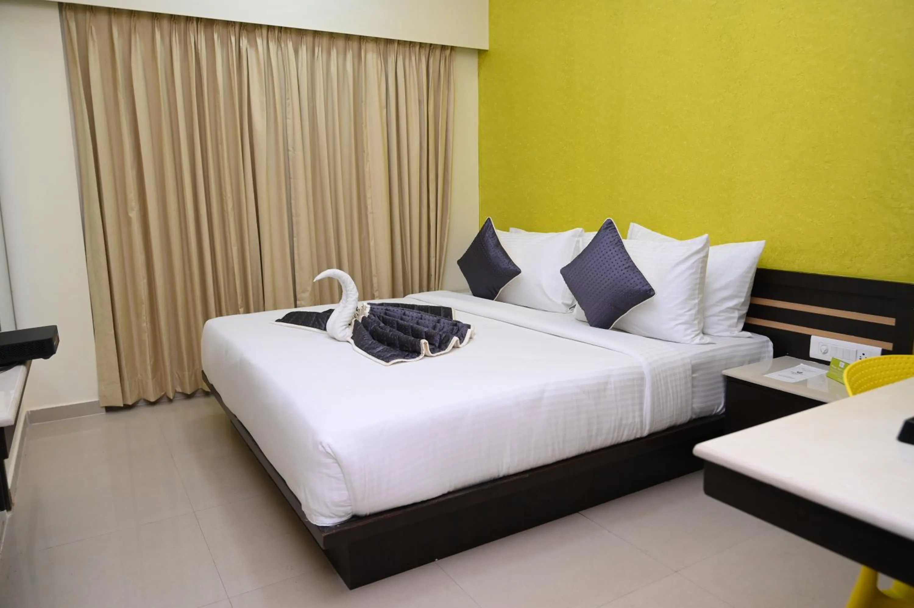 View (from property/room), Bed in RAJKIYAM - A Business Hotel