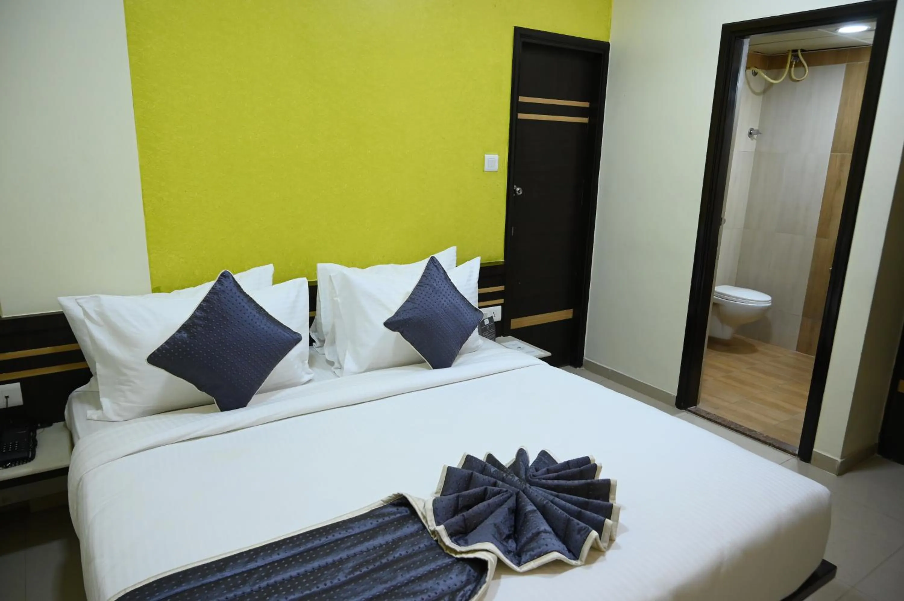 Bed in RAJKIYAM - A Business Hotel