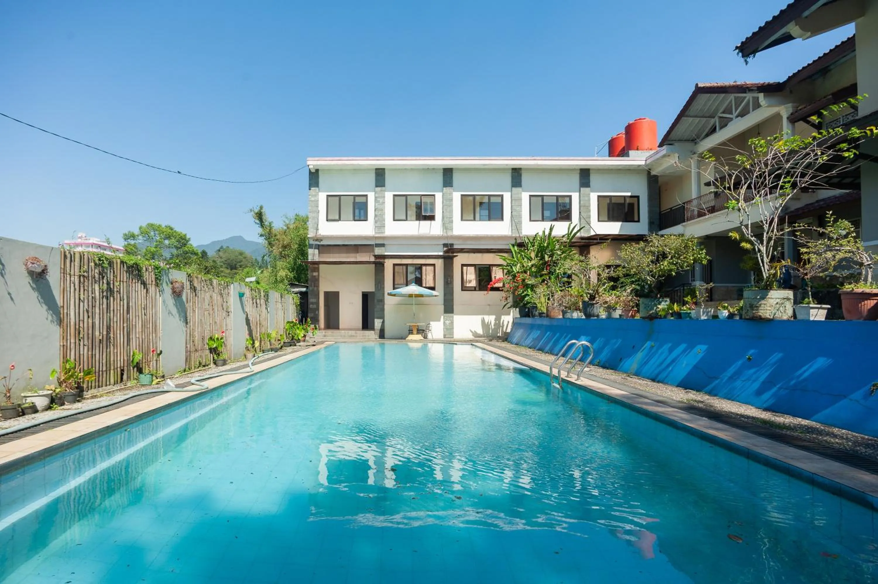 Swimming pool in Urbanview Hotel Syariah Villa SM Cisarua Puncak by RedDoorz