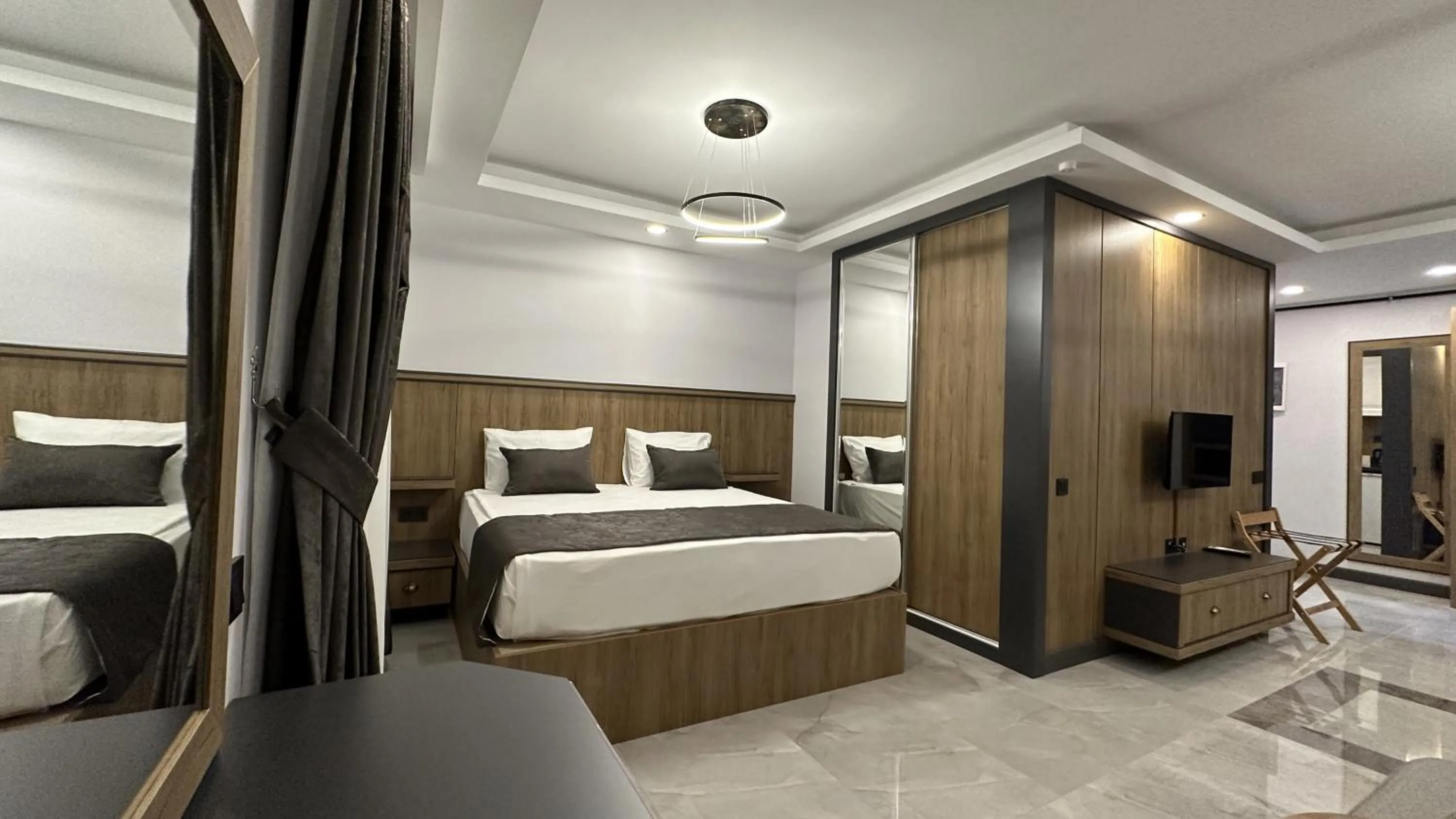 Bed in Quality Gold Suite Hotel