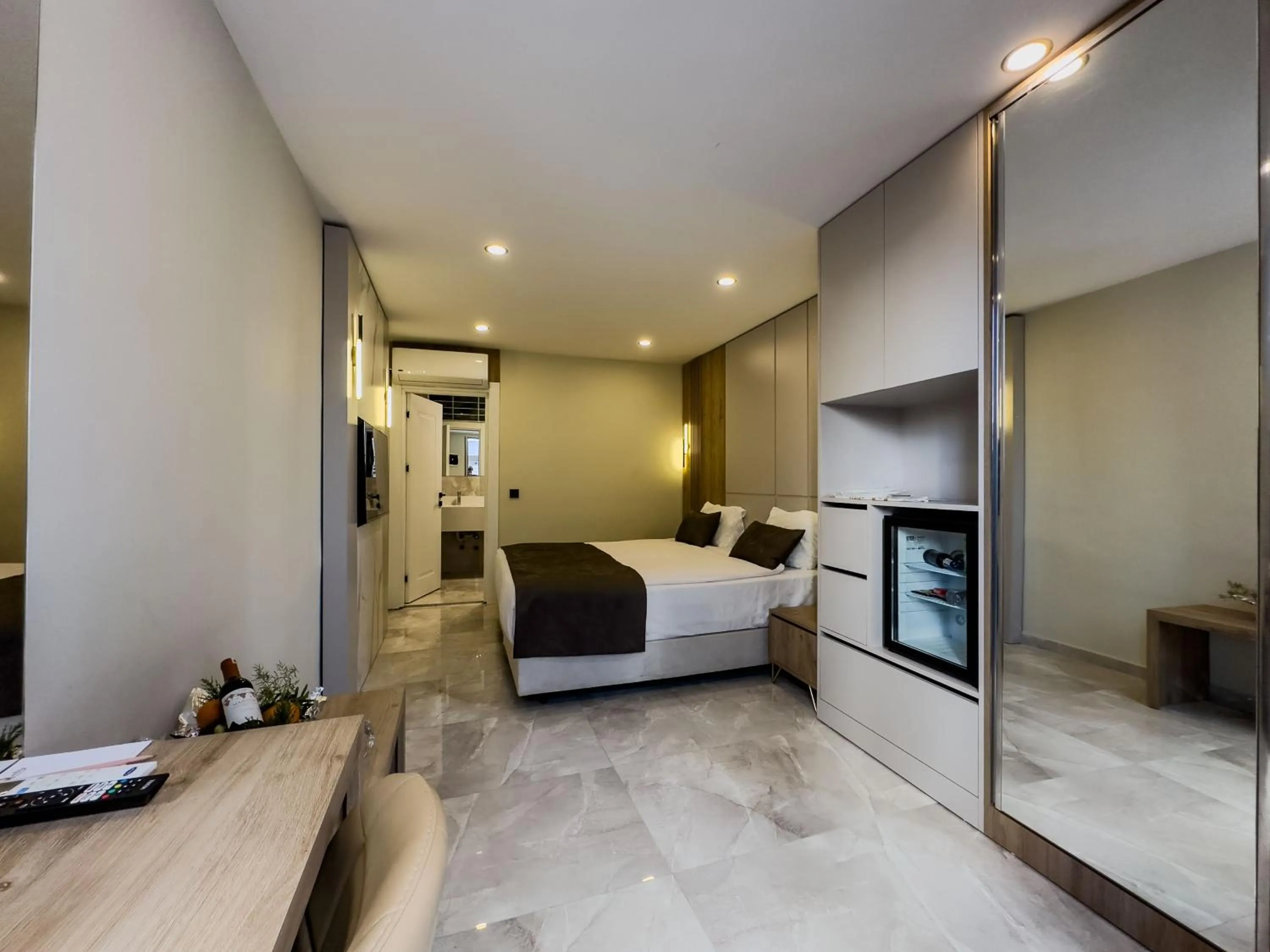 Bed in Quality Gold Suite Hotel