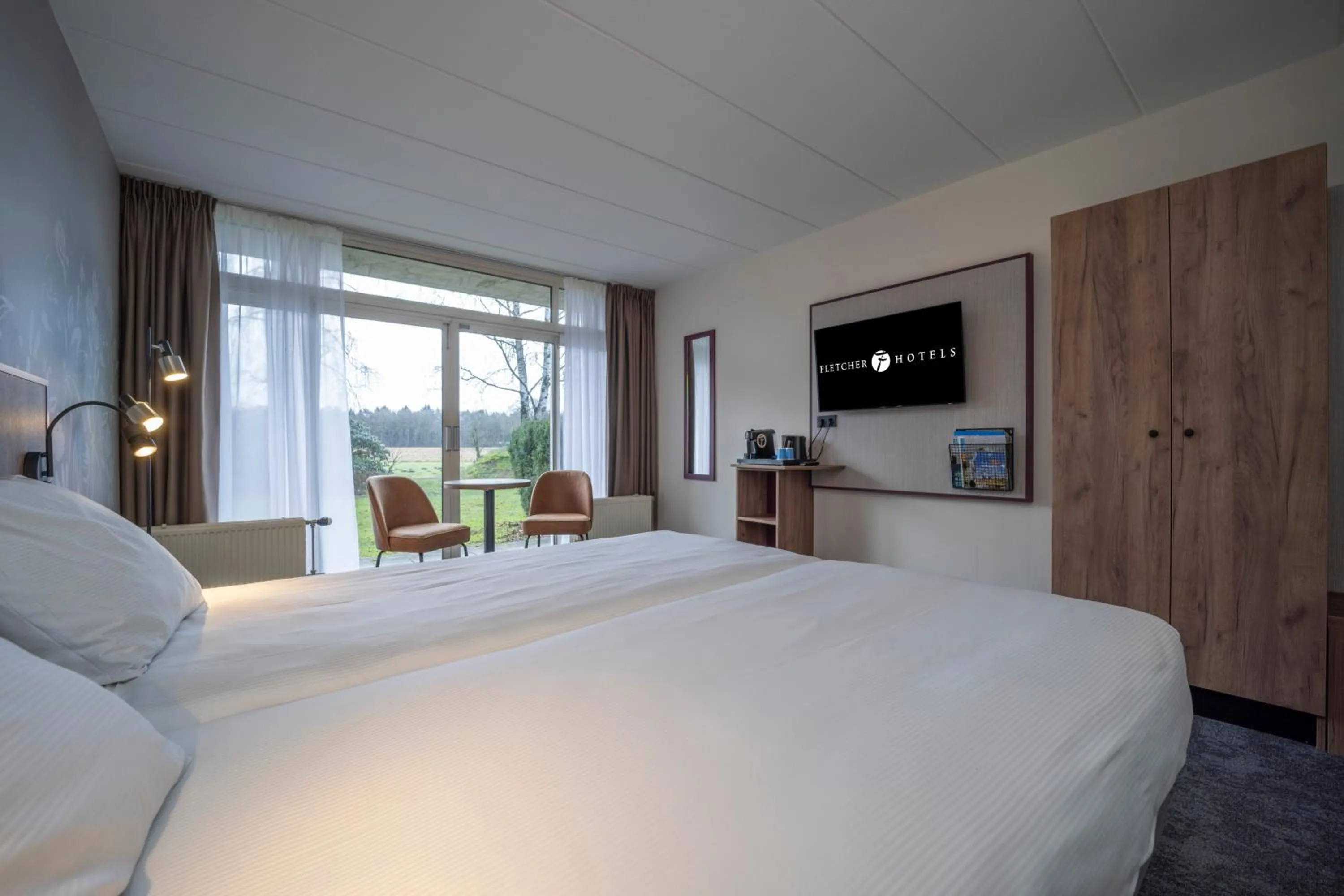 Photo of the whole room, Bed in Fletcher Hotel - Restaurant de Zeegser Duinen