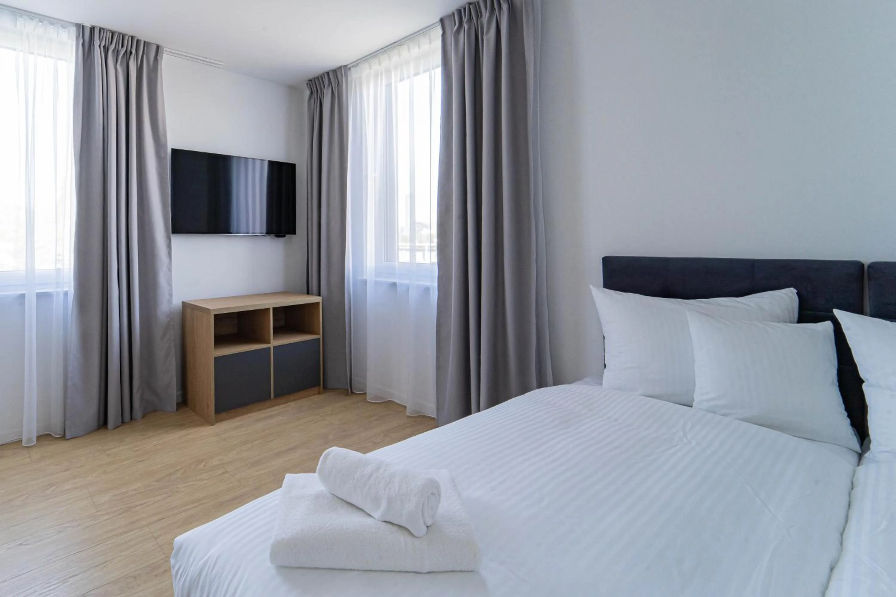 Bed in Milo Aparthotel