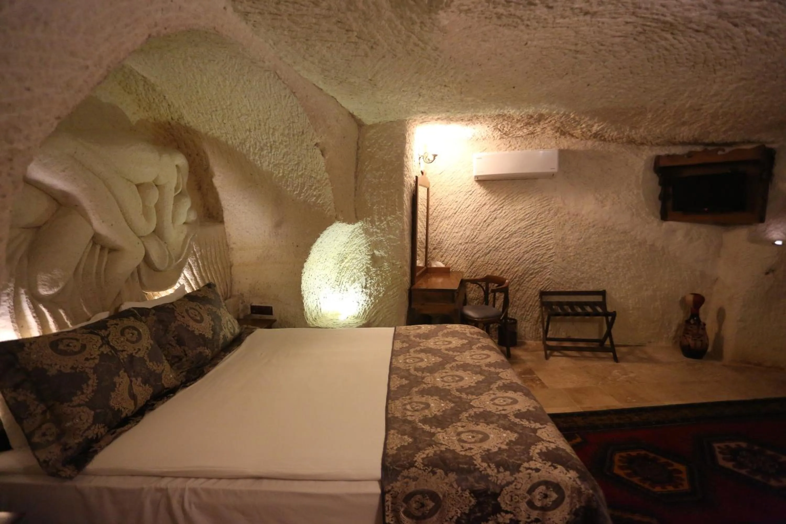 Bed in Phocas Cave Suites