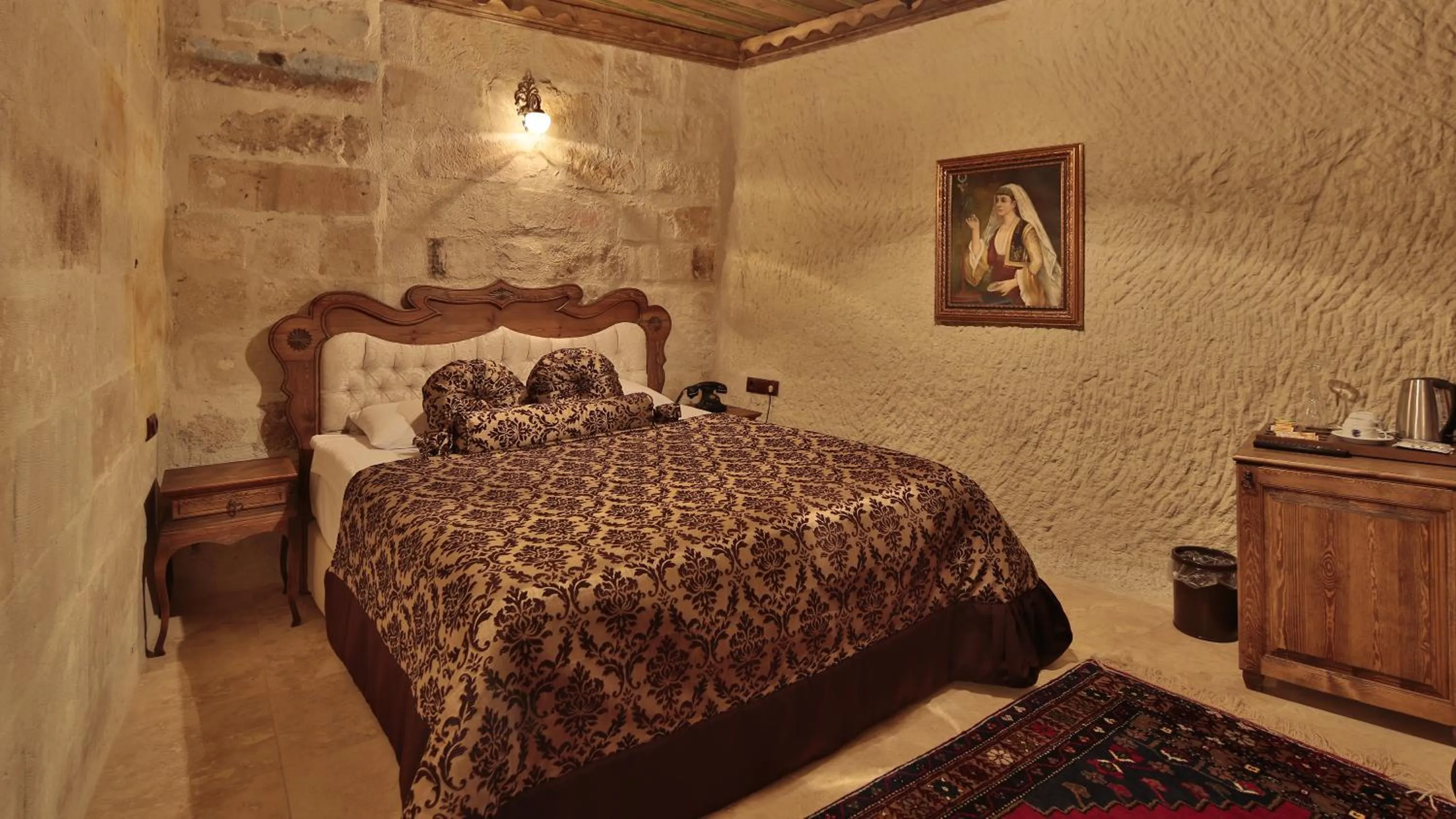 Bed in Phocas Cave Suites