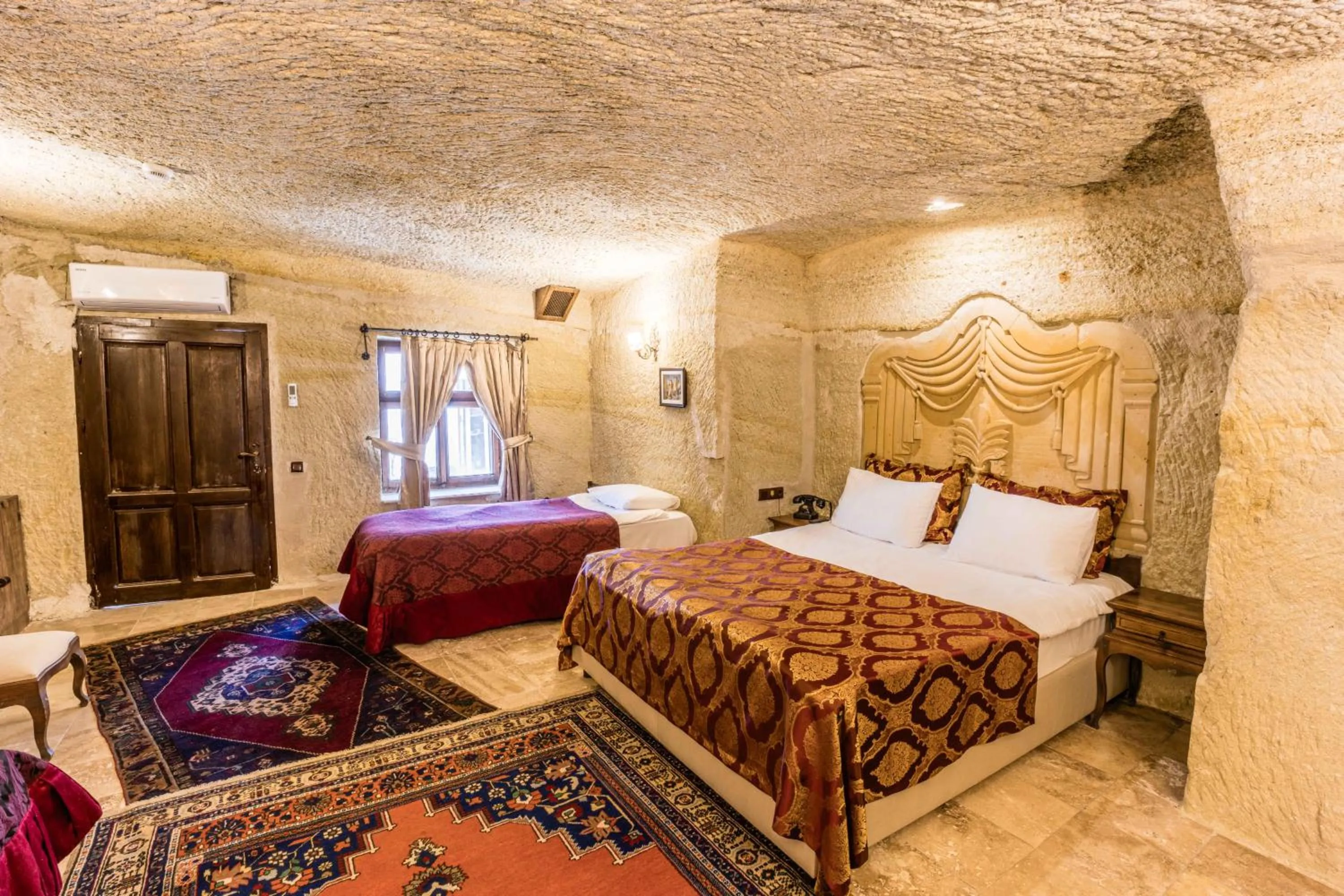 Bed in Phocas Cave Suites