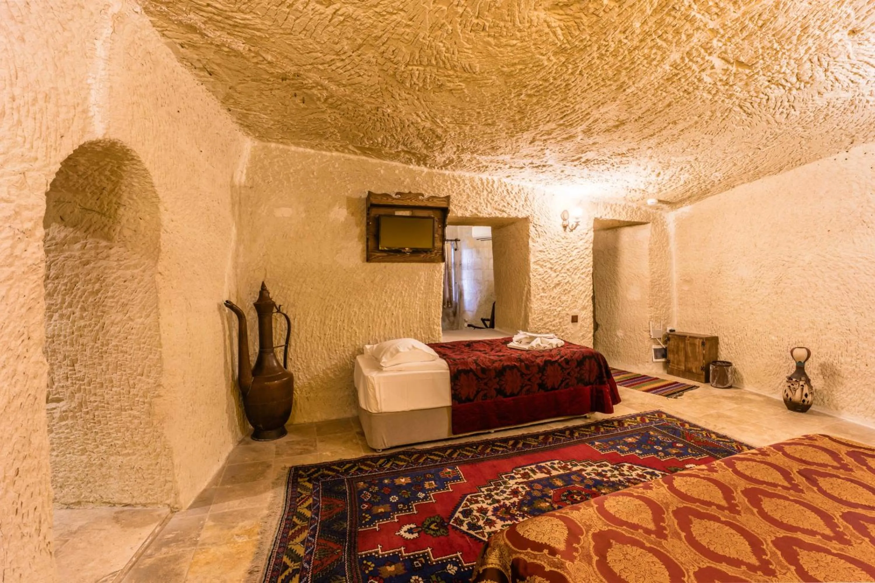 Bed in Phocas Cave Suites