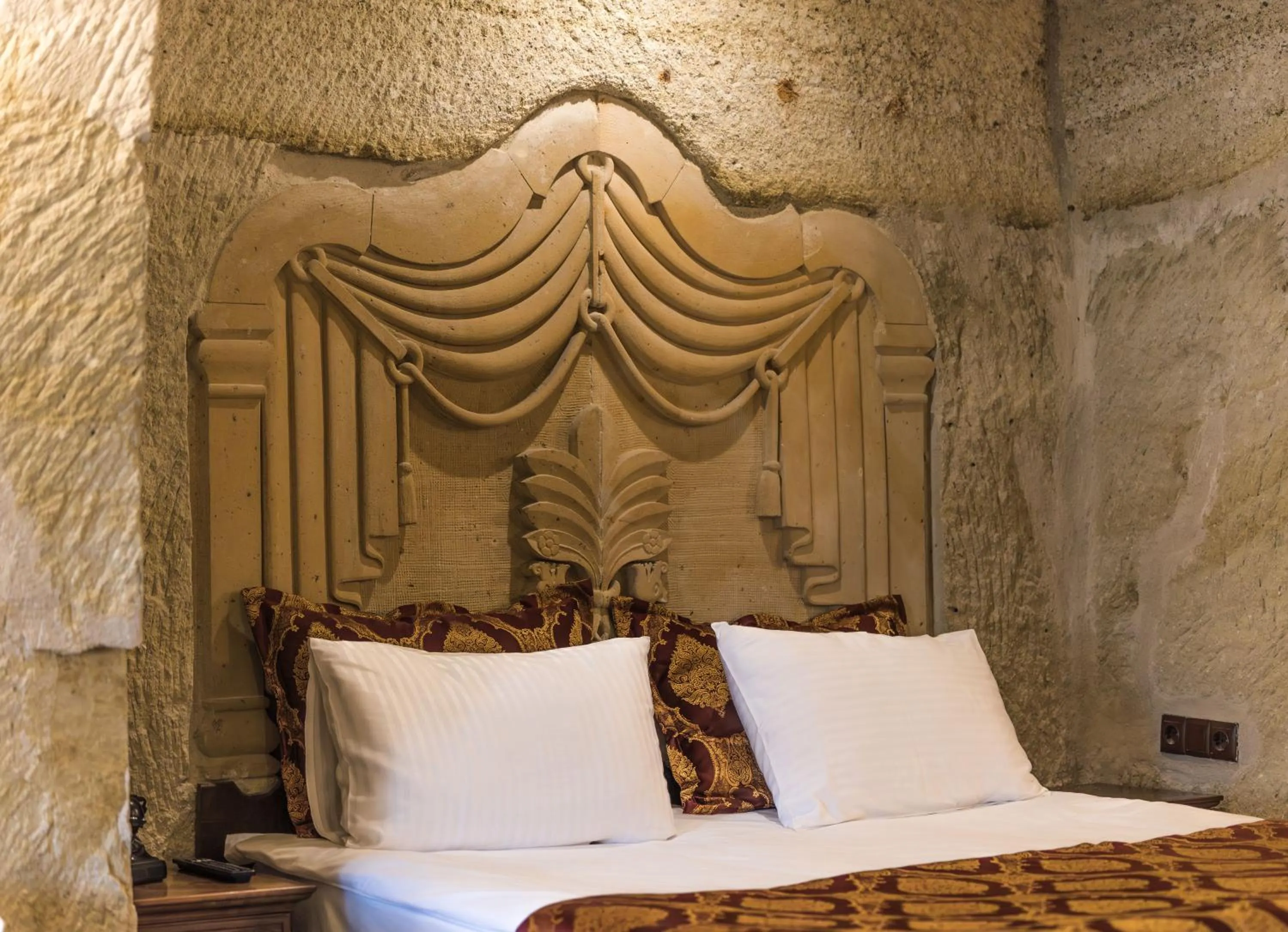 Bed in Phocas Cave Suites