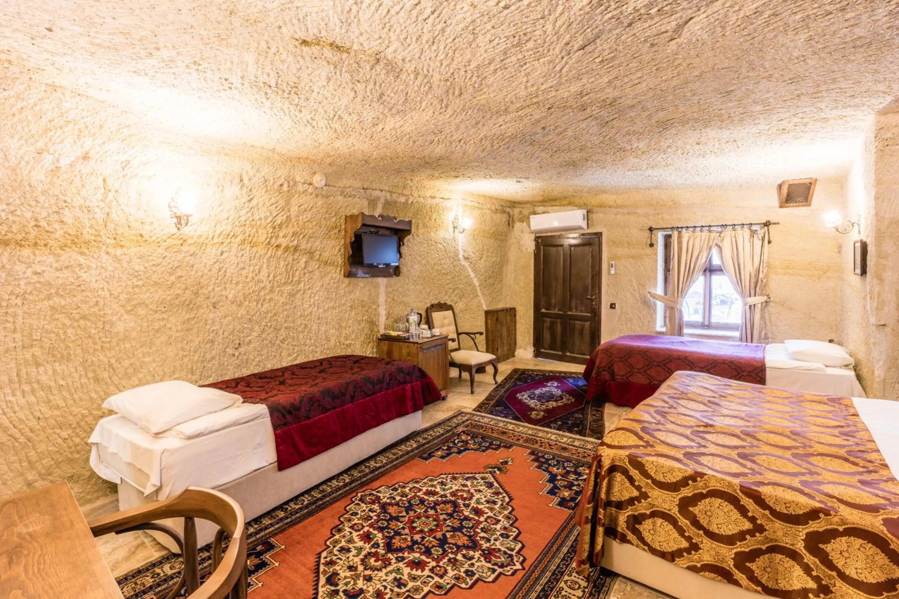 Bed in Phocas Cave Suites