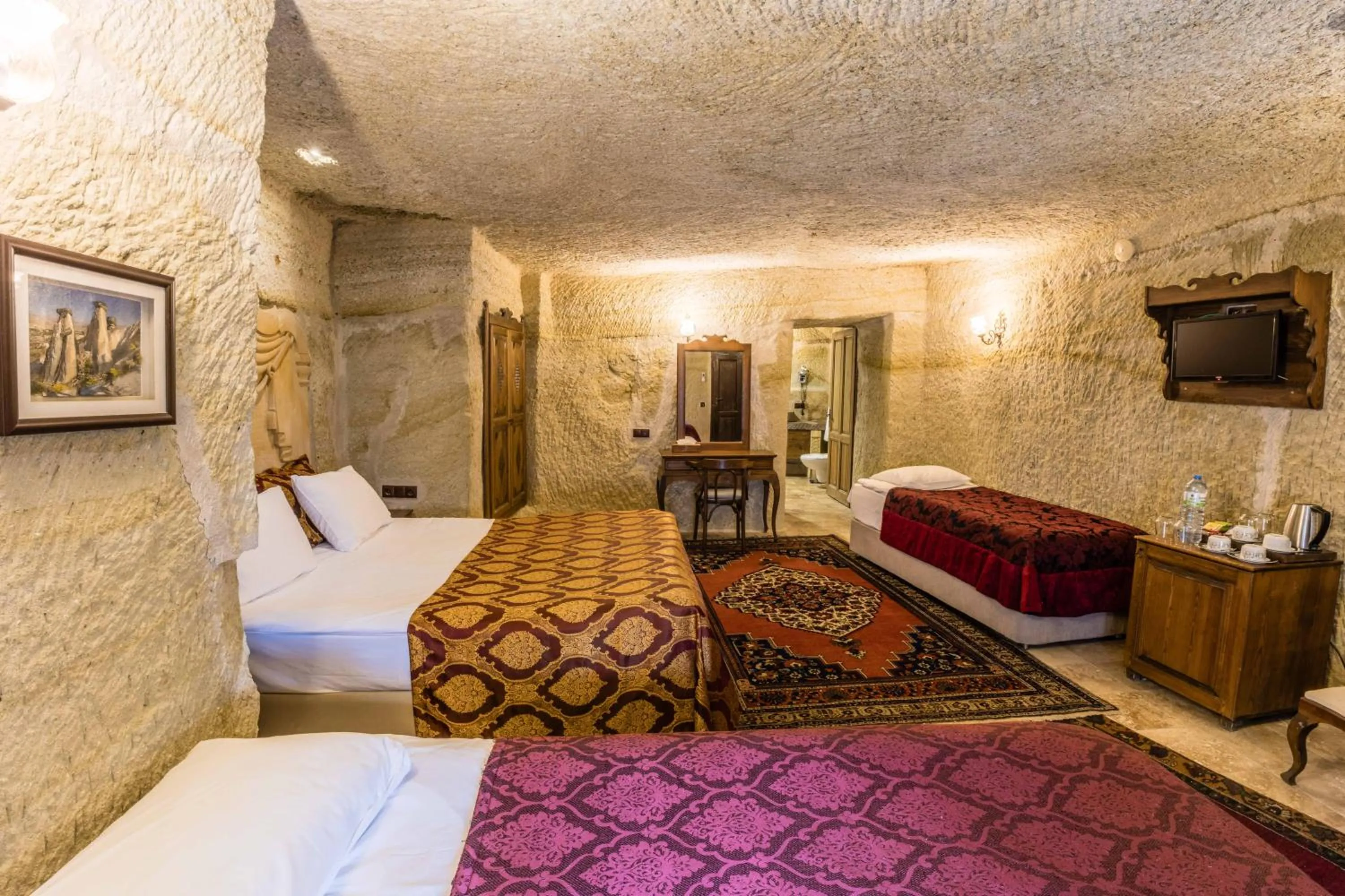 Bed in Phocas Cave Suites